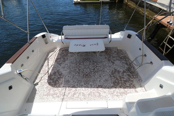 1992 Sea Ray 350 Express Bridge boat deck with seating and table.