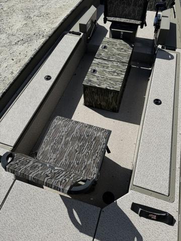 2024 SeaArk 31652 CRAPPIE boat interior with camo seating and storage compartments.