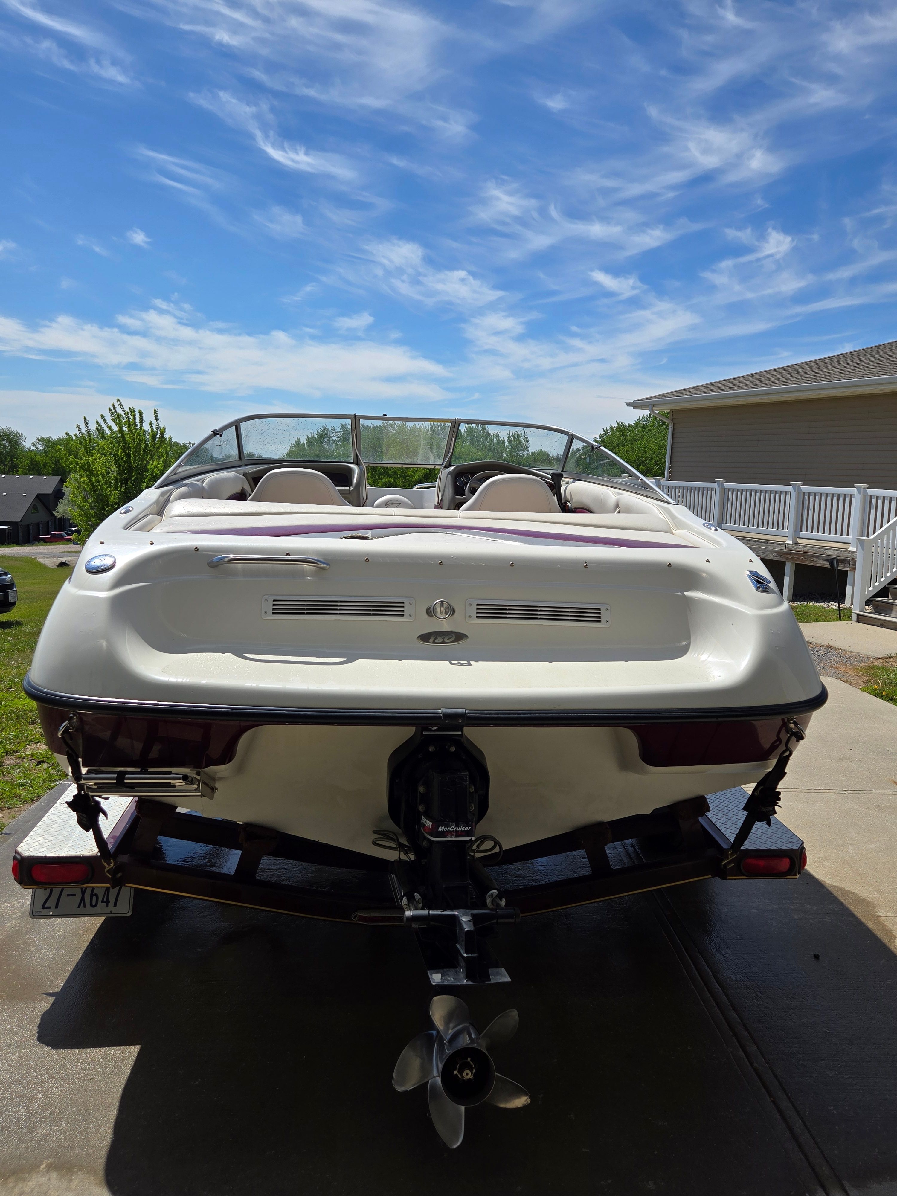 Rear view of a 2001 Crownline 180 BR boat on a trailer, ready for the water.