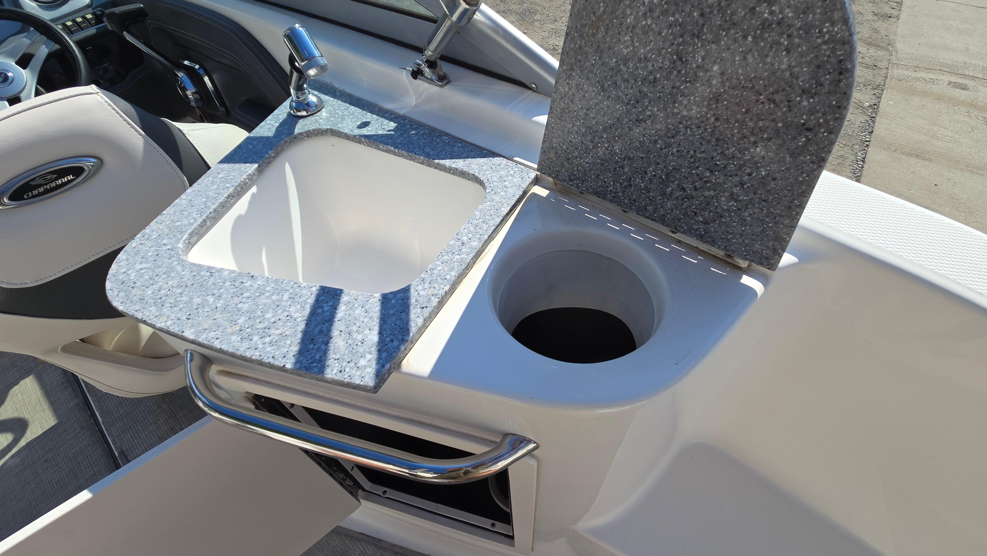 2018 Chaparral 224 Sunesta boat interior with sink and countertop.