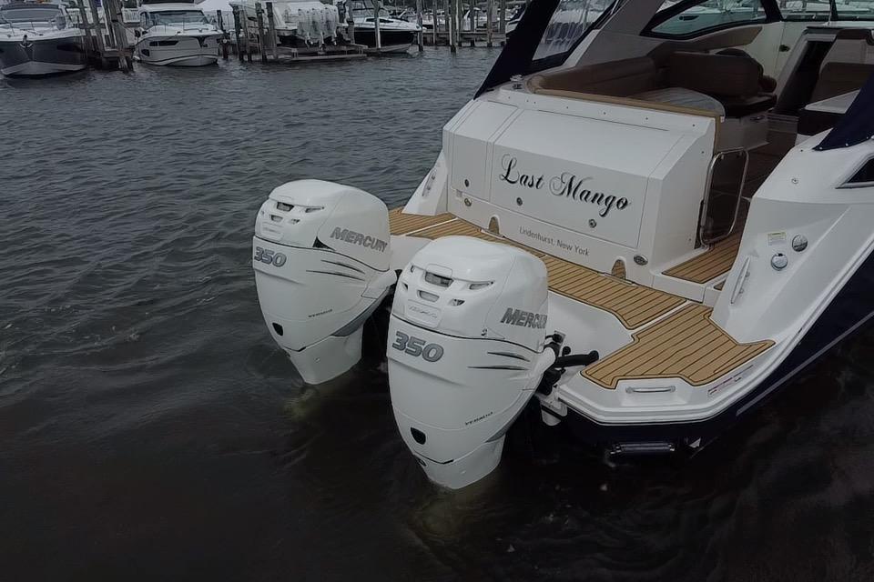 2021 Sea Ray Sundancer 320 Outboard with twin Mercury 350 engines docked.