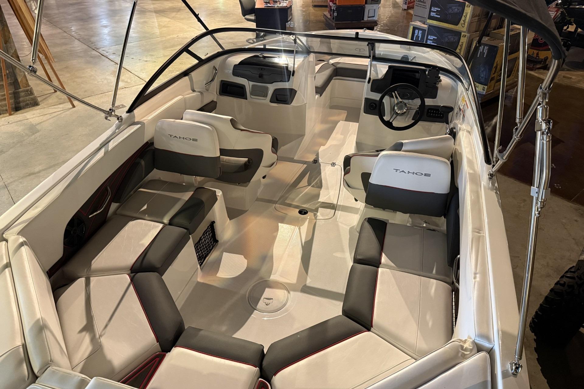 2024 Tahoe 210 S boat interior with sleek seating and modern dashboard design.