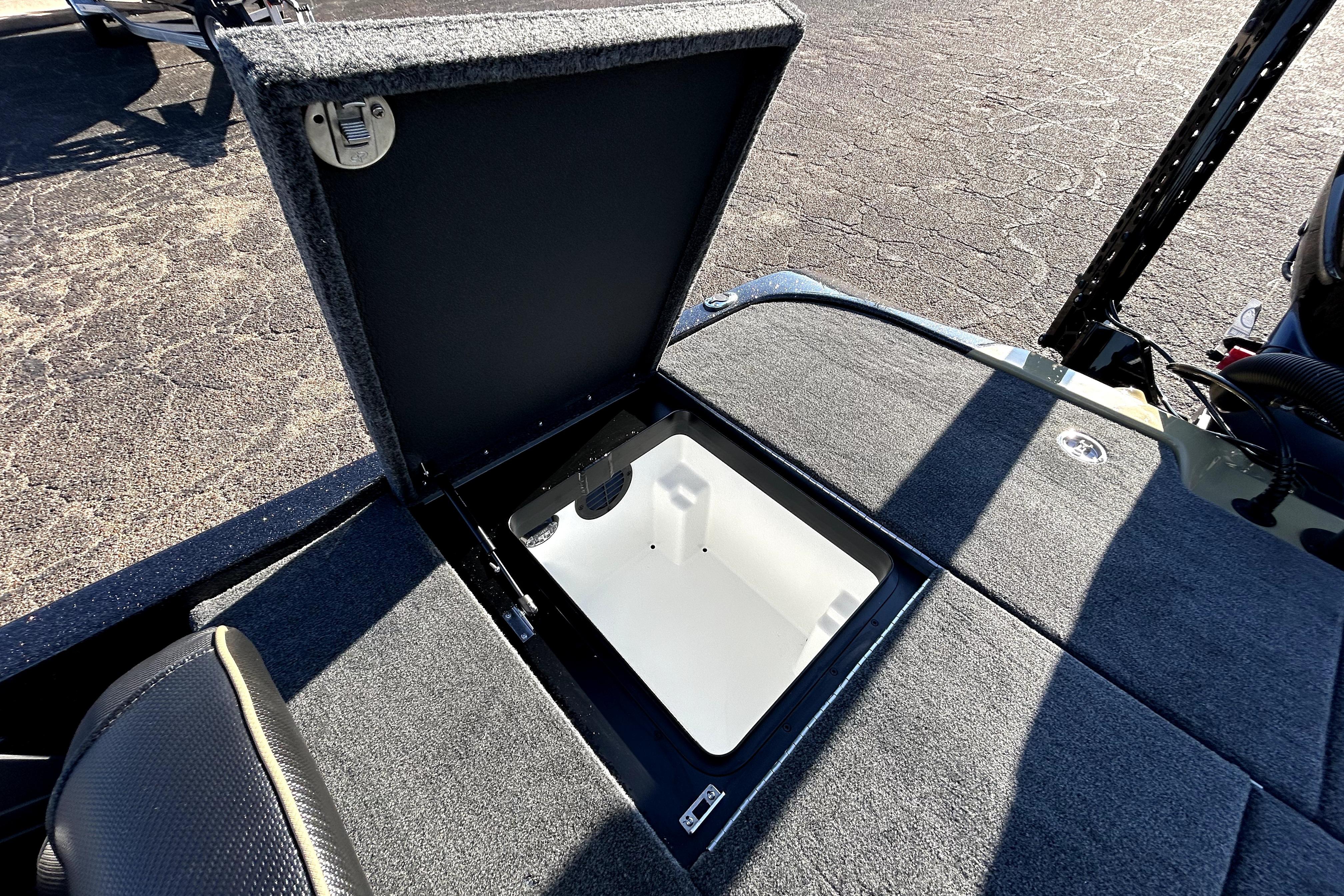 Open storage compartment on 2026 Skeeter ZXE21 boat deck.