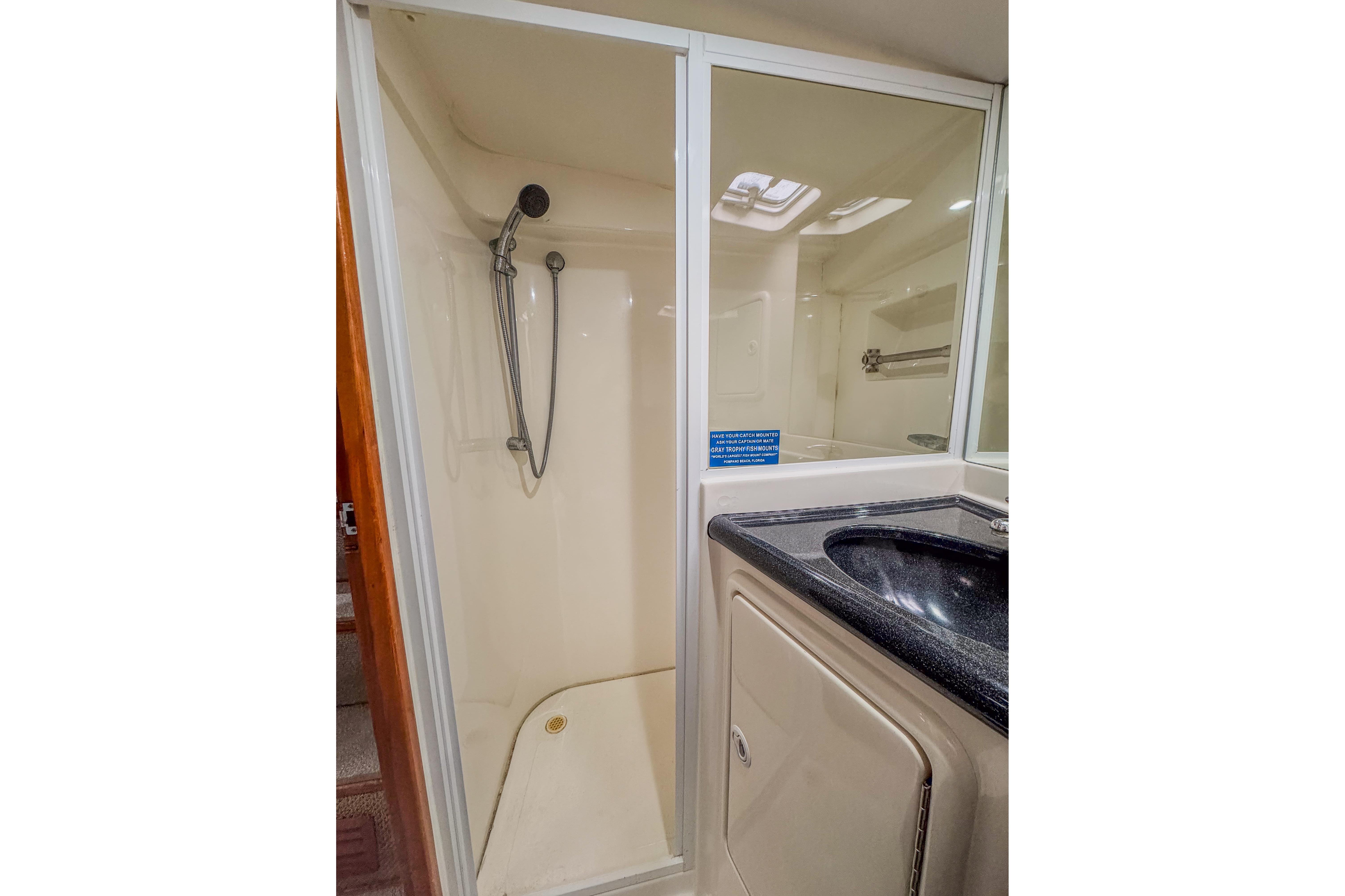 Bathroom interior of 2001 Black Watch 40 yacht with shower and sink.