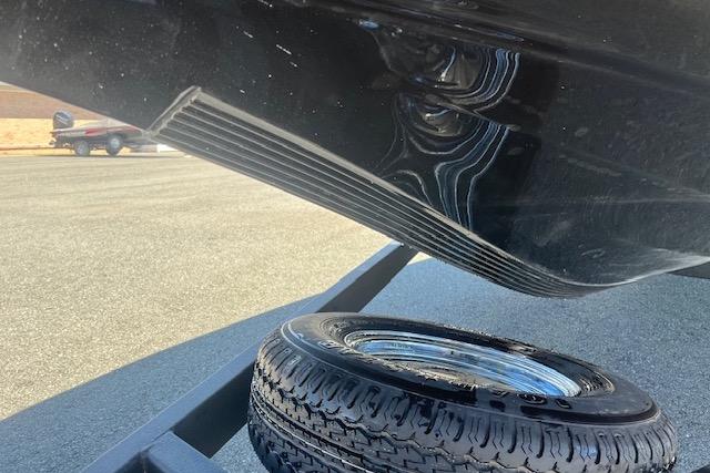 Nitro Z18 Pro 2026 boat hull and spare tire on trailer.