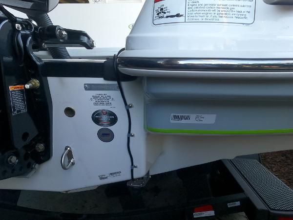 Close-up of 2023 Tahoe 2150 CC boat's rear section with labels and hardware.