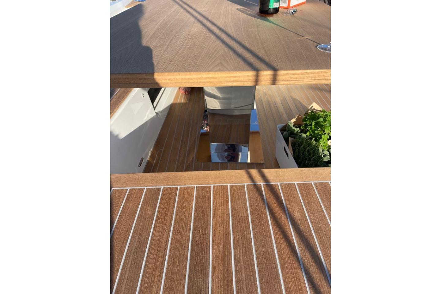 Teak deck of 2022 Solaris 64RS yacht with herbs and drinks.