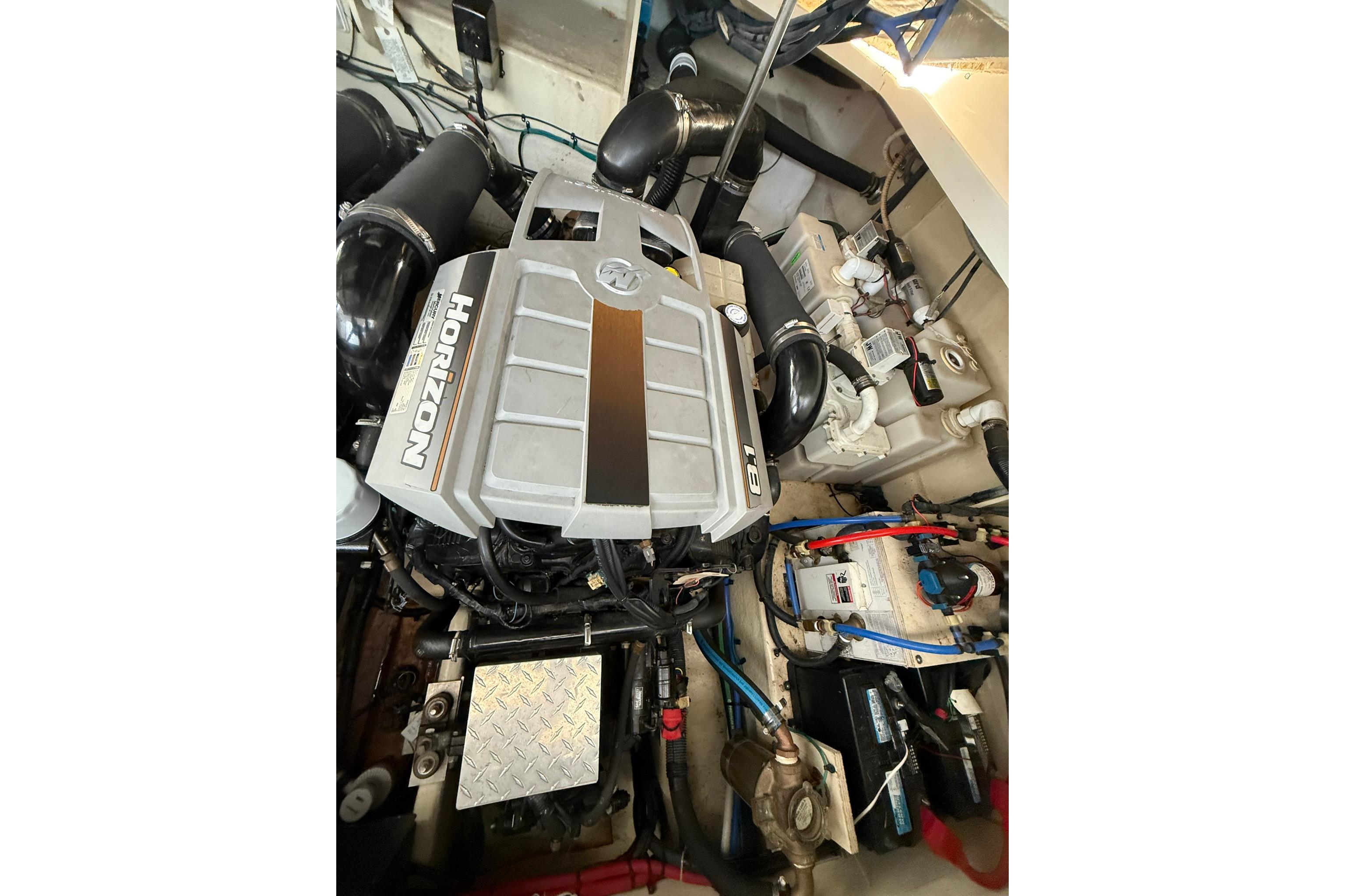 Engine compartment of a 2009 Sea Ray 350 Sundancer boat, featuring Horizon 8.1 engine.