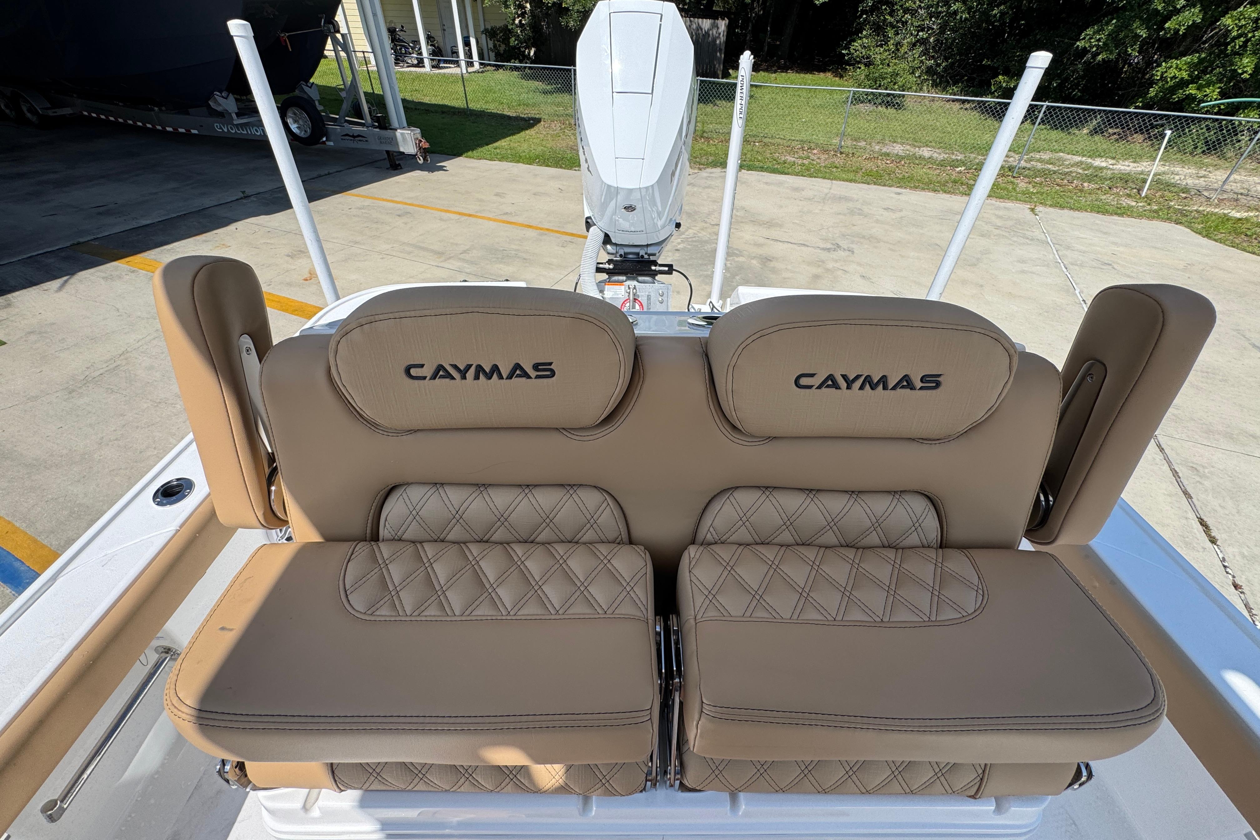 2027 Caymas 26 HB boat seats with tan upholstery and diamond stitching detail.