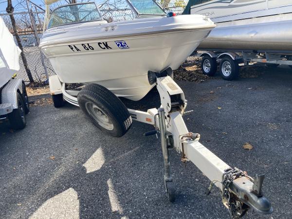 2001 Sea Ray 180 Bow Rider on trailer, parked outdoors.