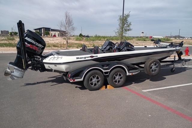 2017 Ranger Z521 Comanche Cup-Equipped boat with Mercury engine in parking lot.
