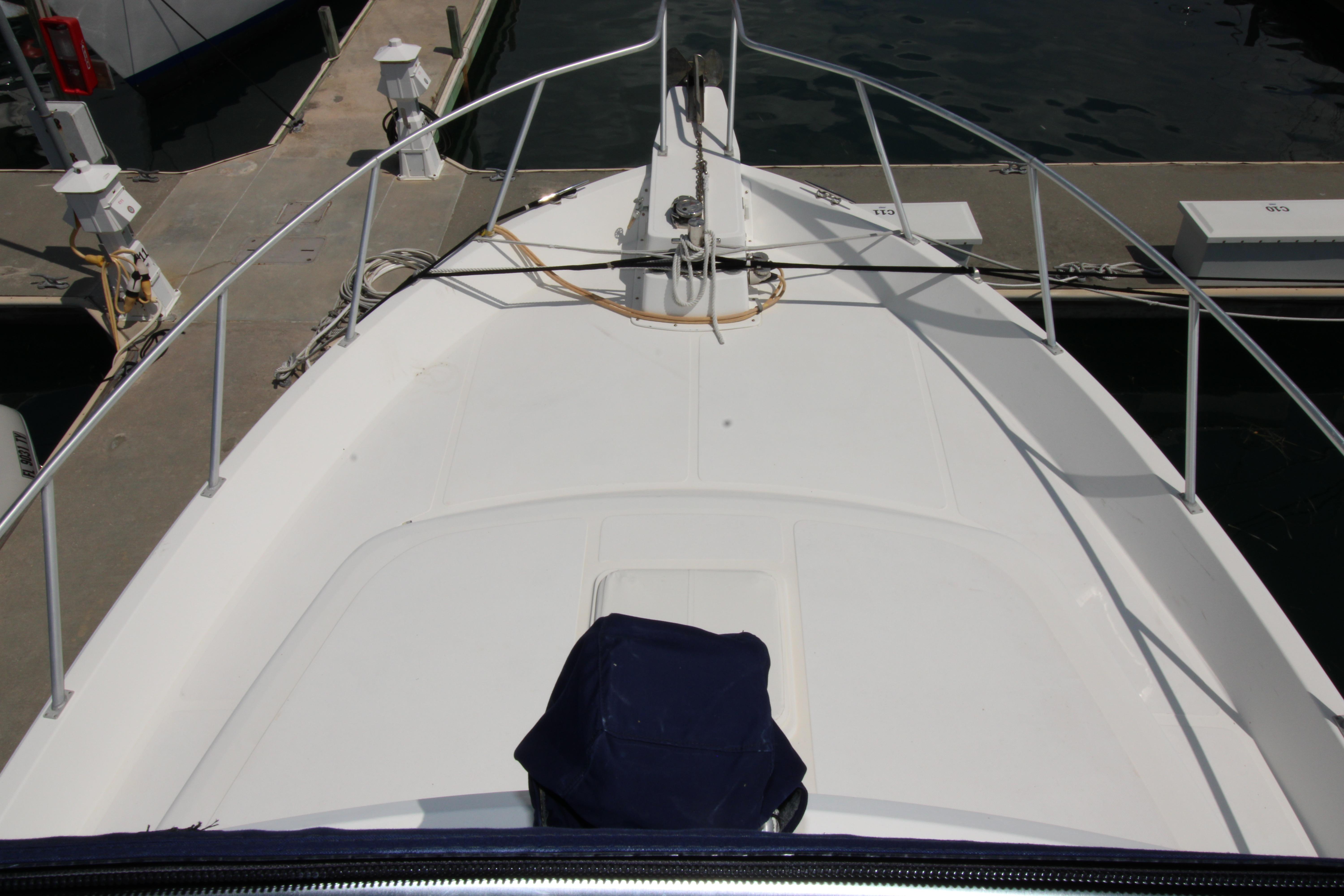 Bow view of a 2000 Ricker 42 Classic yacht docked at a marina.