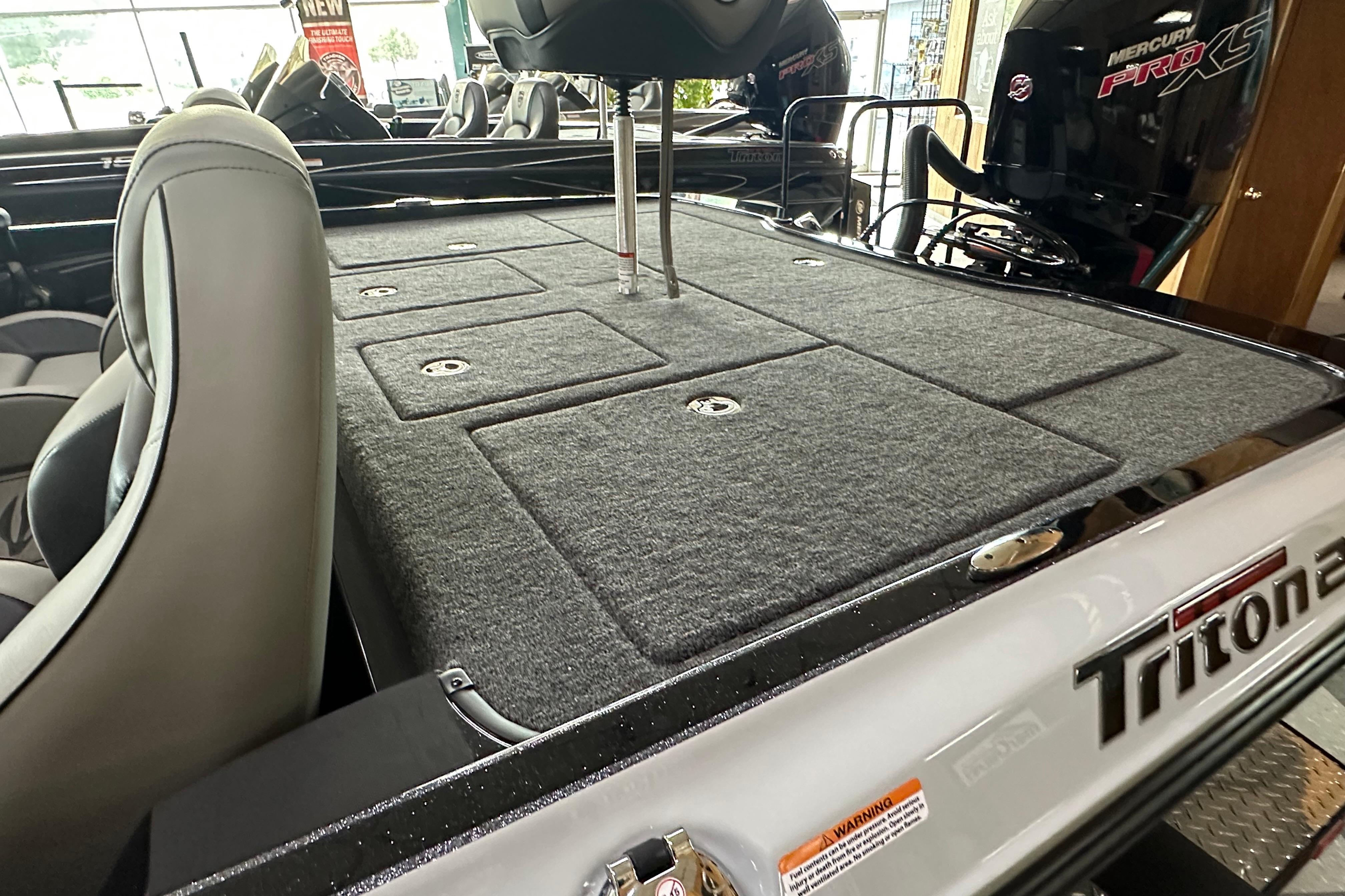 2024 Triton 20XP Patriot boat interior with Mercury Pro XS engine, showcasing spacious deck layout.