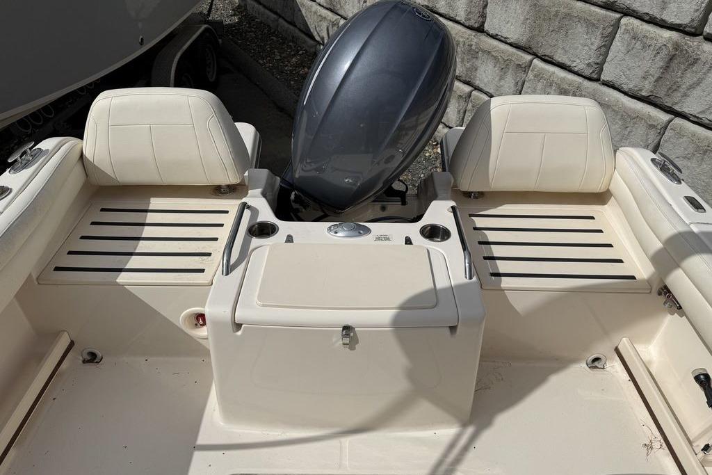 2019 Grady-White Freedom 215 boat interior with seating and engine view.