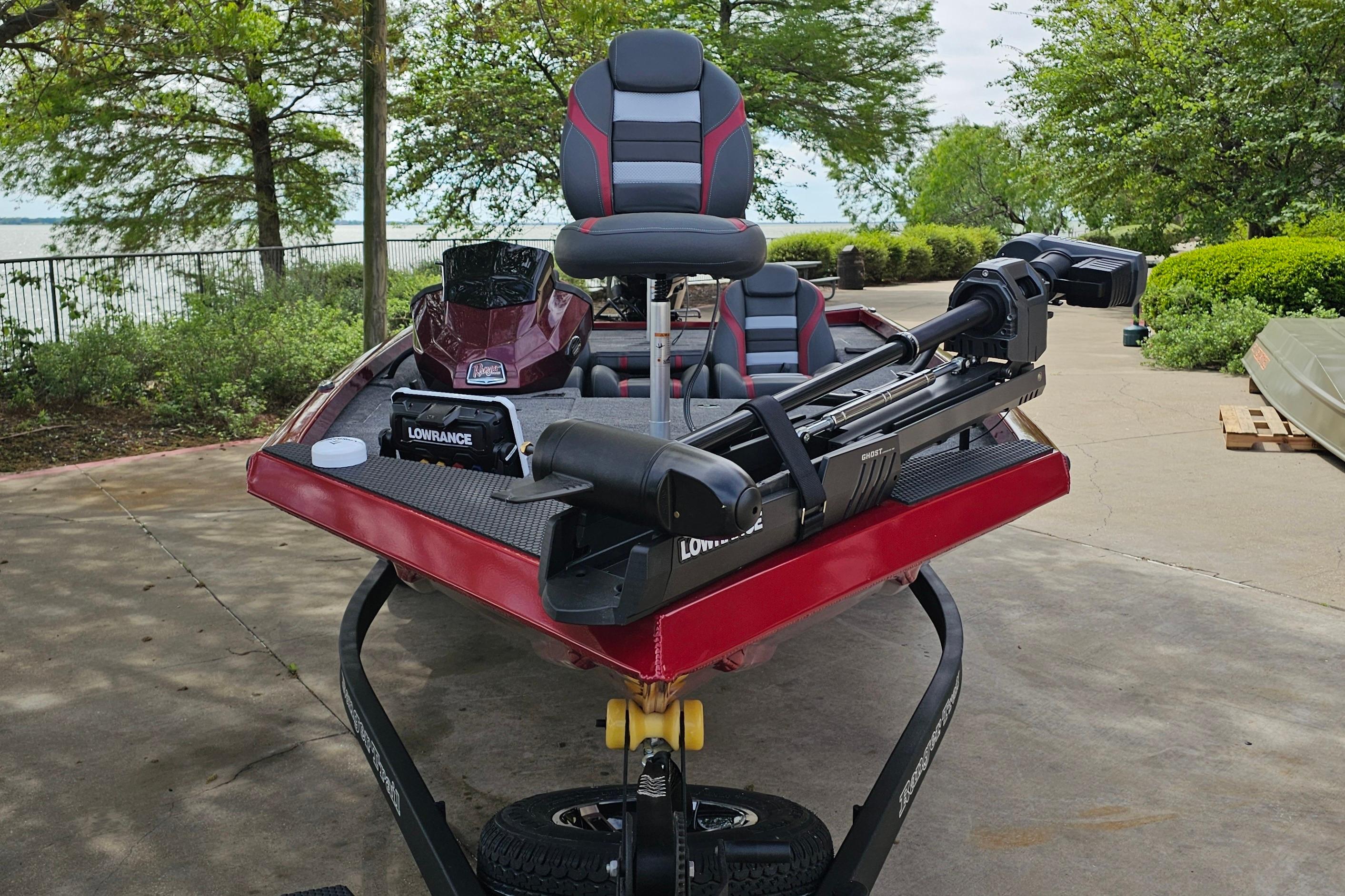 2026 Ranger RT178 boat with Lowrance equipment, parked outdoors near greenery.