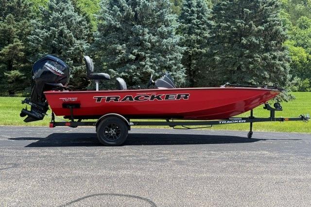 2026 Tracker Pro Team 175 Crappie Edition boat, red, on trailer, parked outdoors.