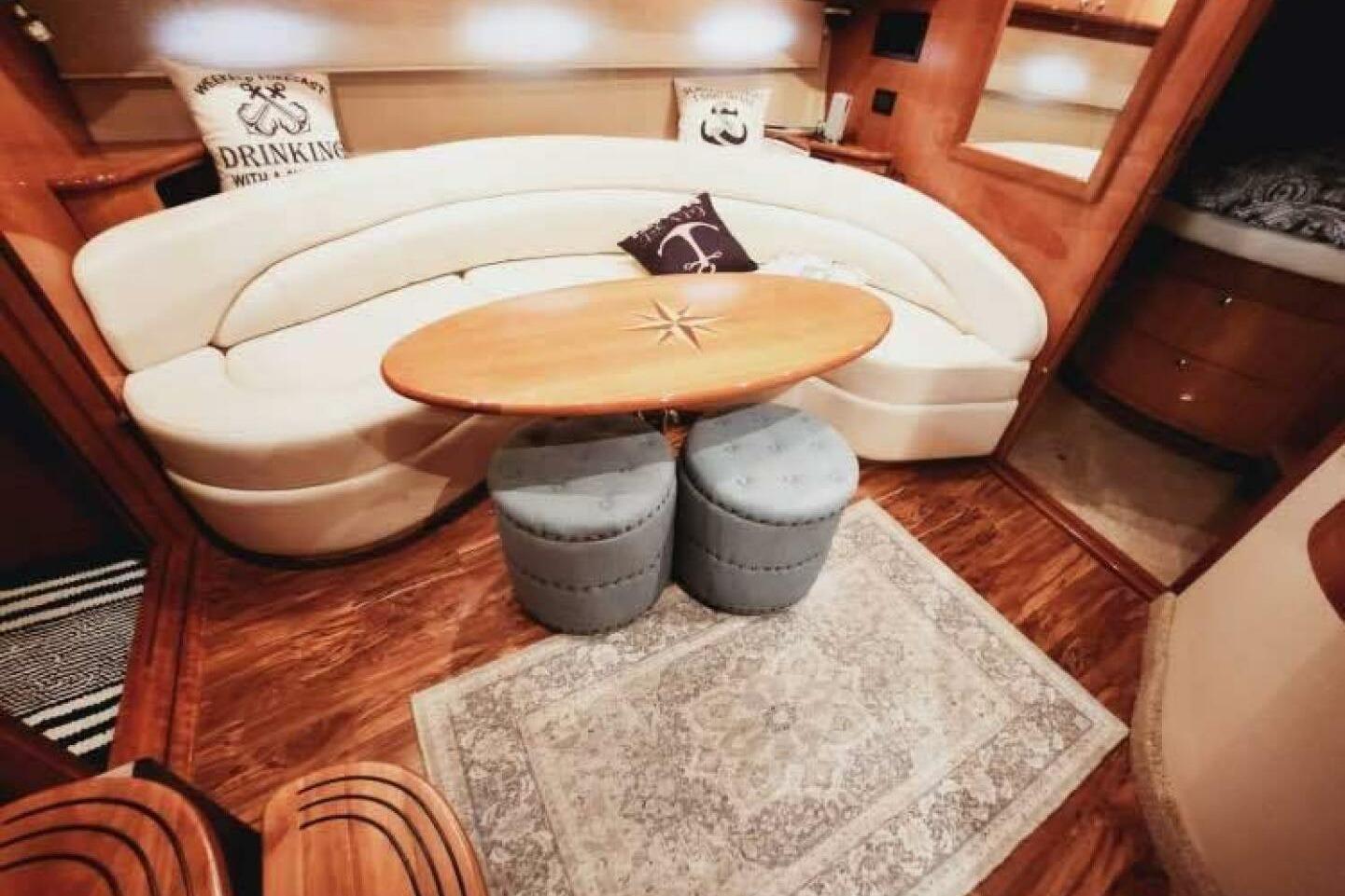 Luxurious interior of 2007 Regal Commodore 4460 yacht with elegant seating and decor.