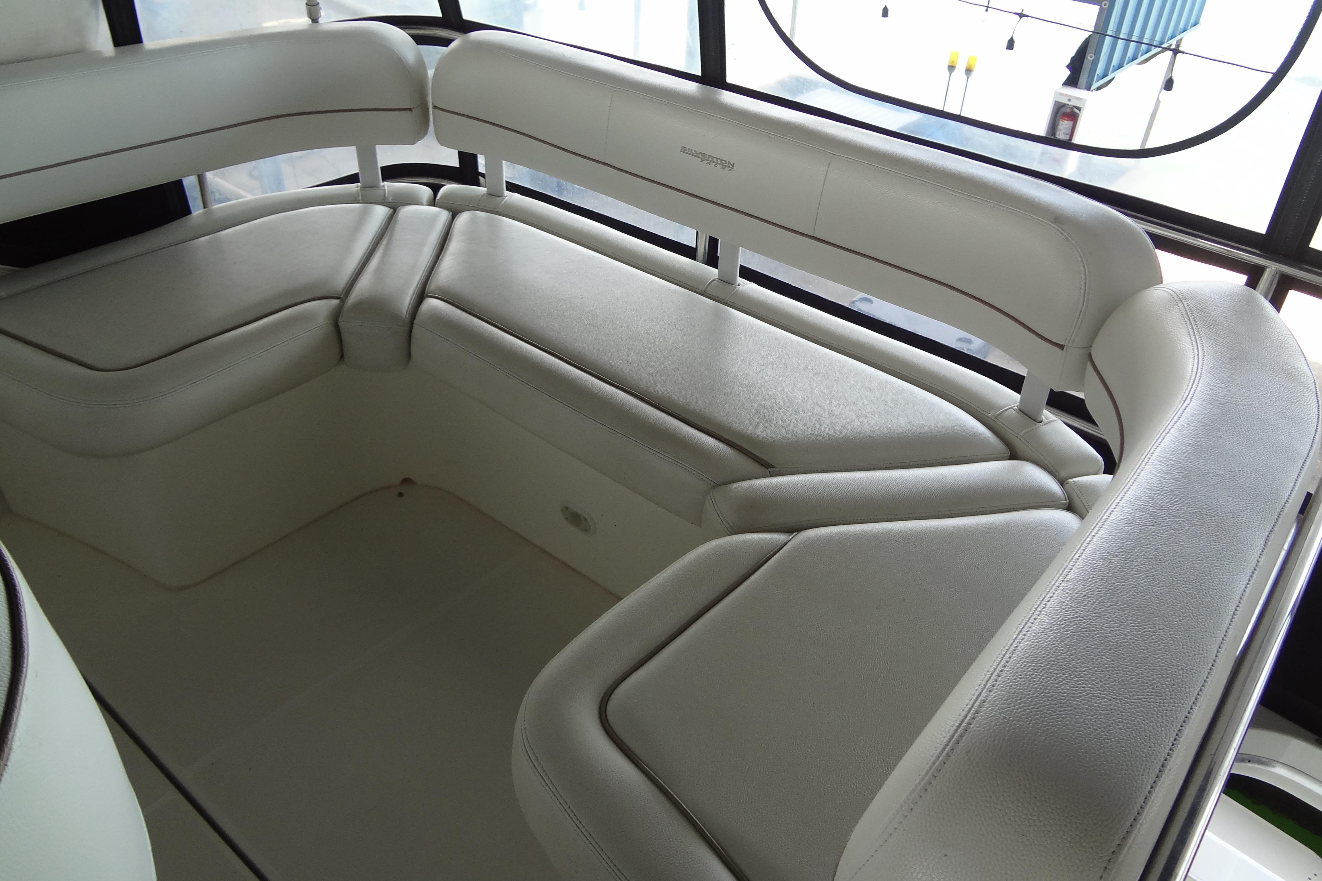 2005 Silverton 34 Convertible boat interior with white cushioned seating.