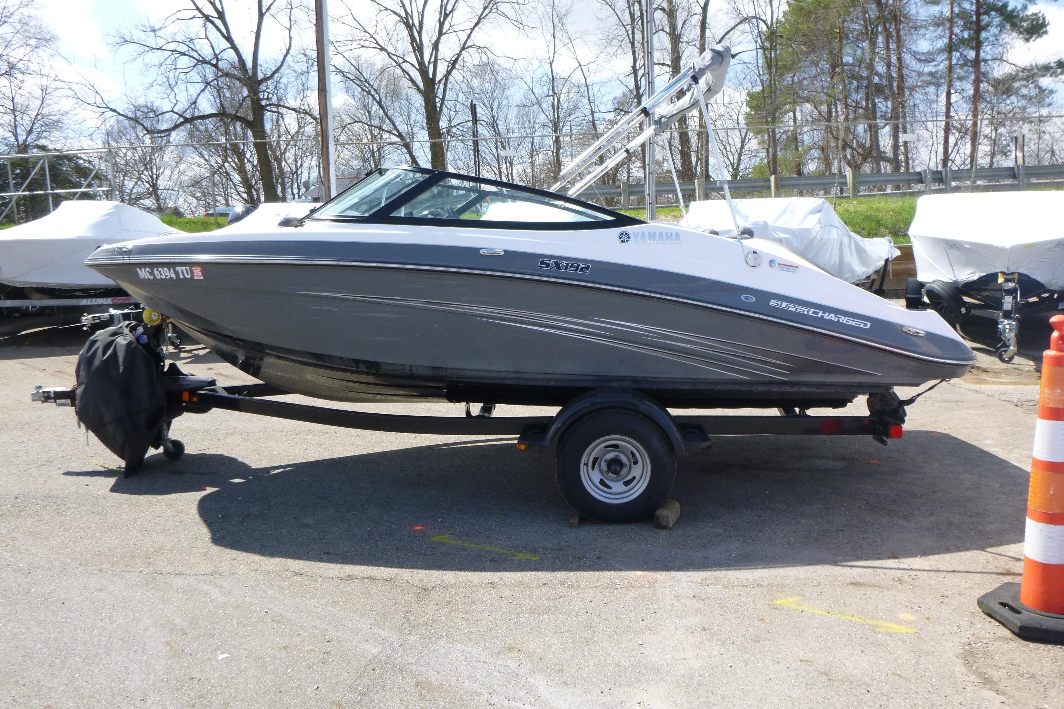 2015 Yamaha SX192 boat parked on trailer outdoors.