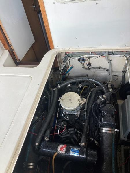 1987 Bertram 28 Sport Fisherman engine compartment with visible wiring and components.