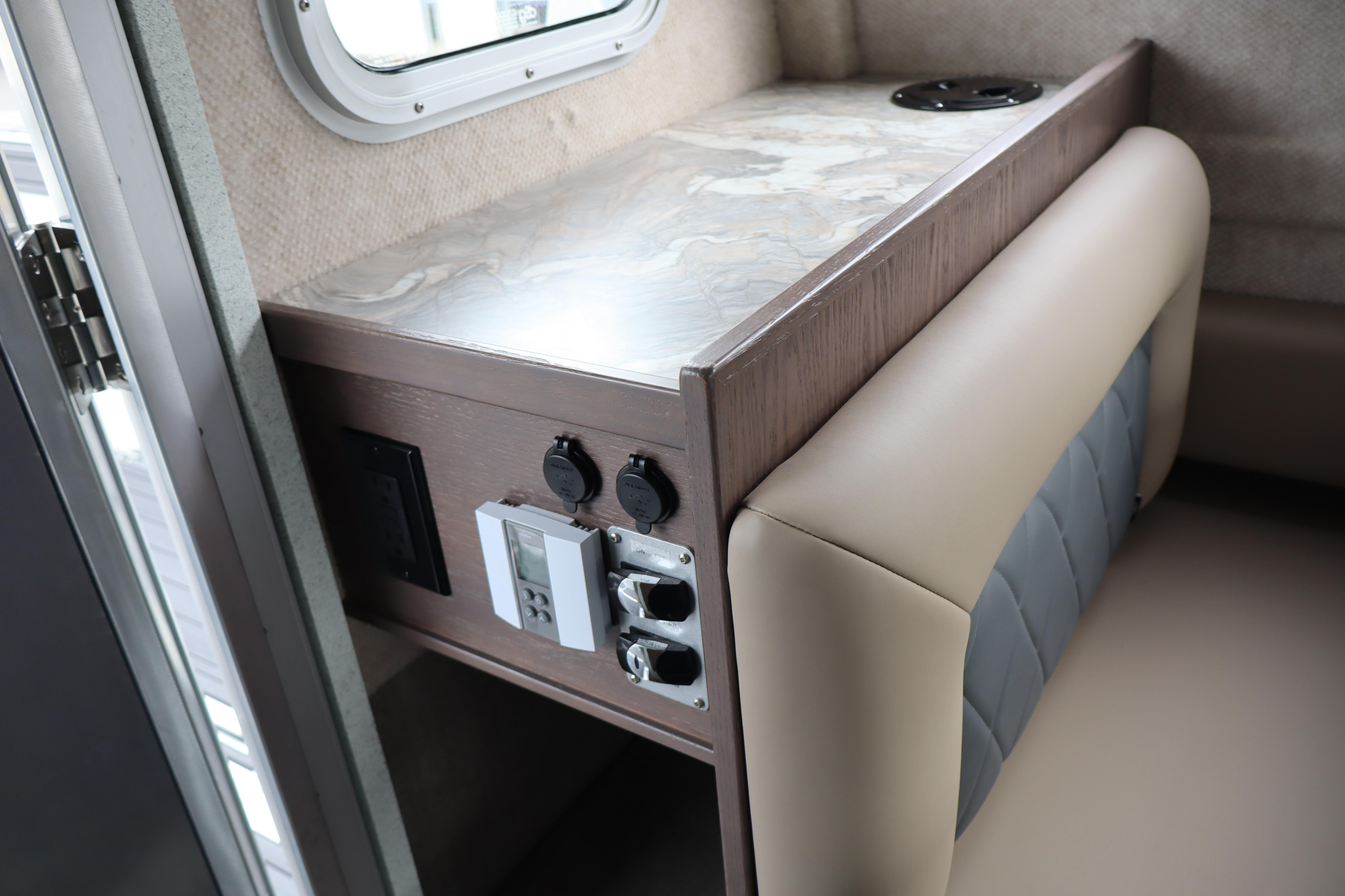 Interior of 2026 KingFisher 3025 XRS boat with modern seating and control panel.