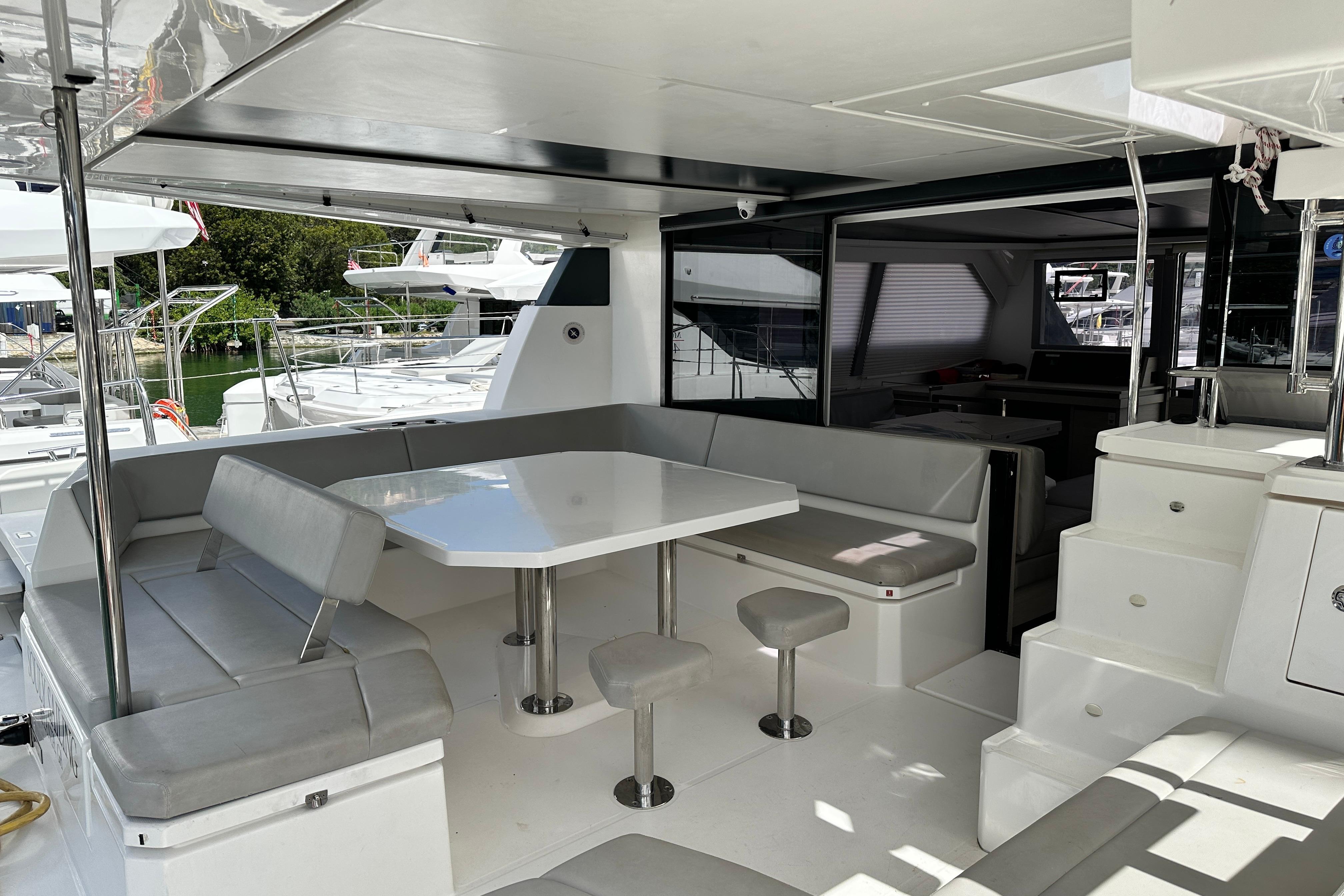 Spacious Leopard 50 yacht interior with modern seating and dining area, 2021 model.