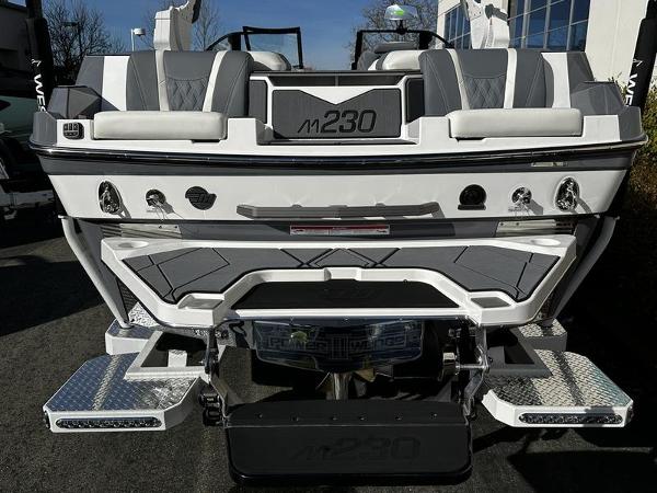 2025 Malibu M230 boat rear view with sleek design and modern features.