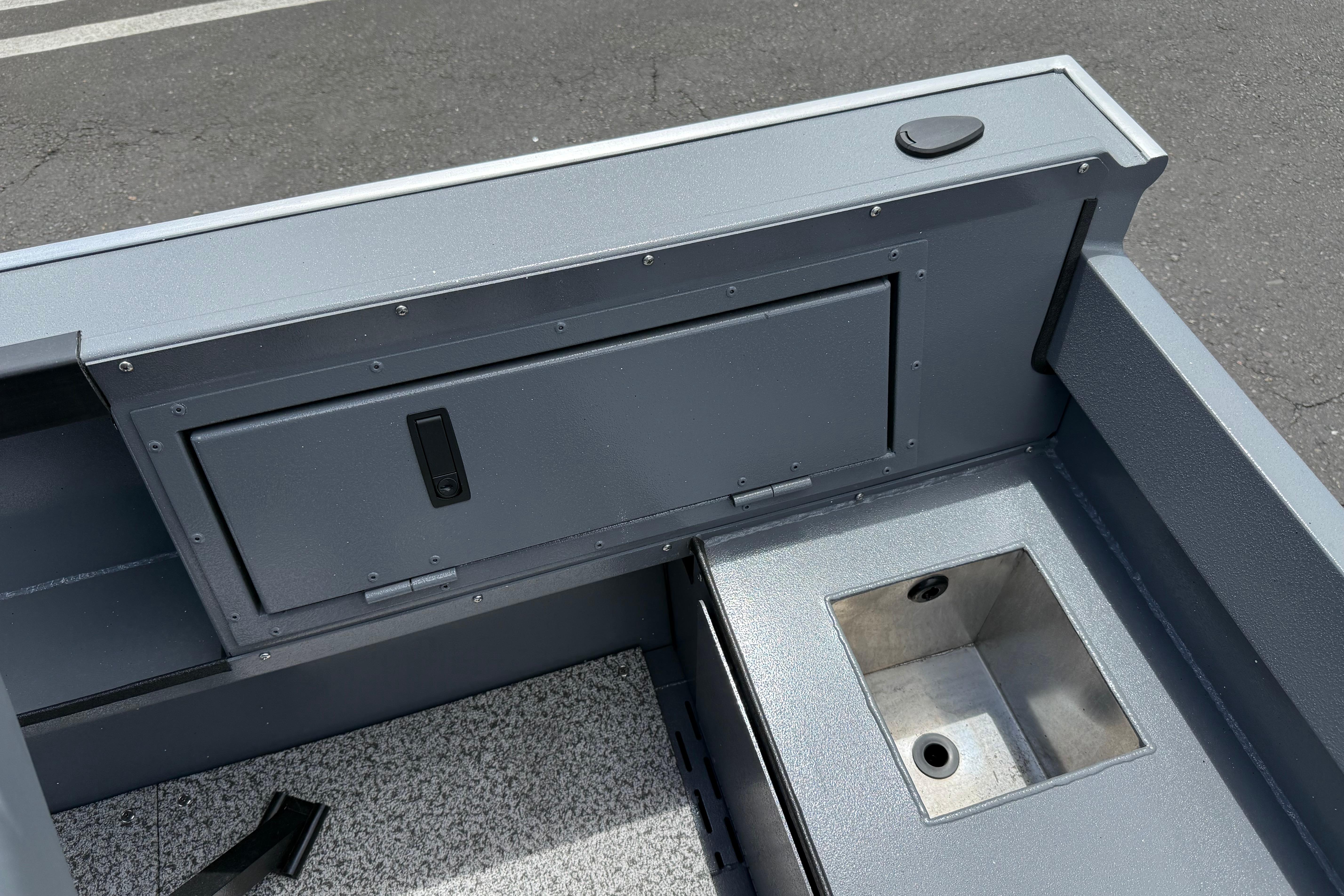 2026 Alumaweld Free Drifter 20 boat interior with storage compartment and sink.
