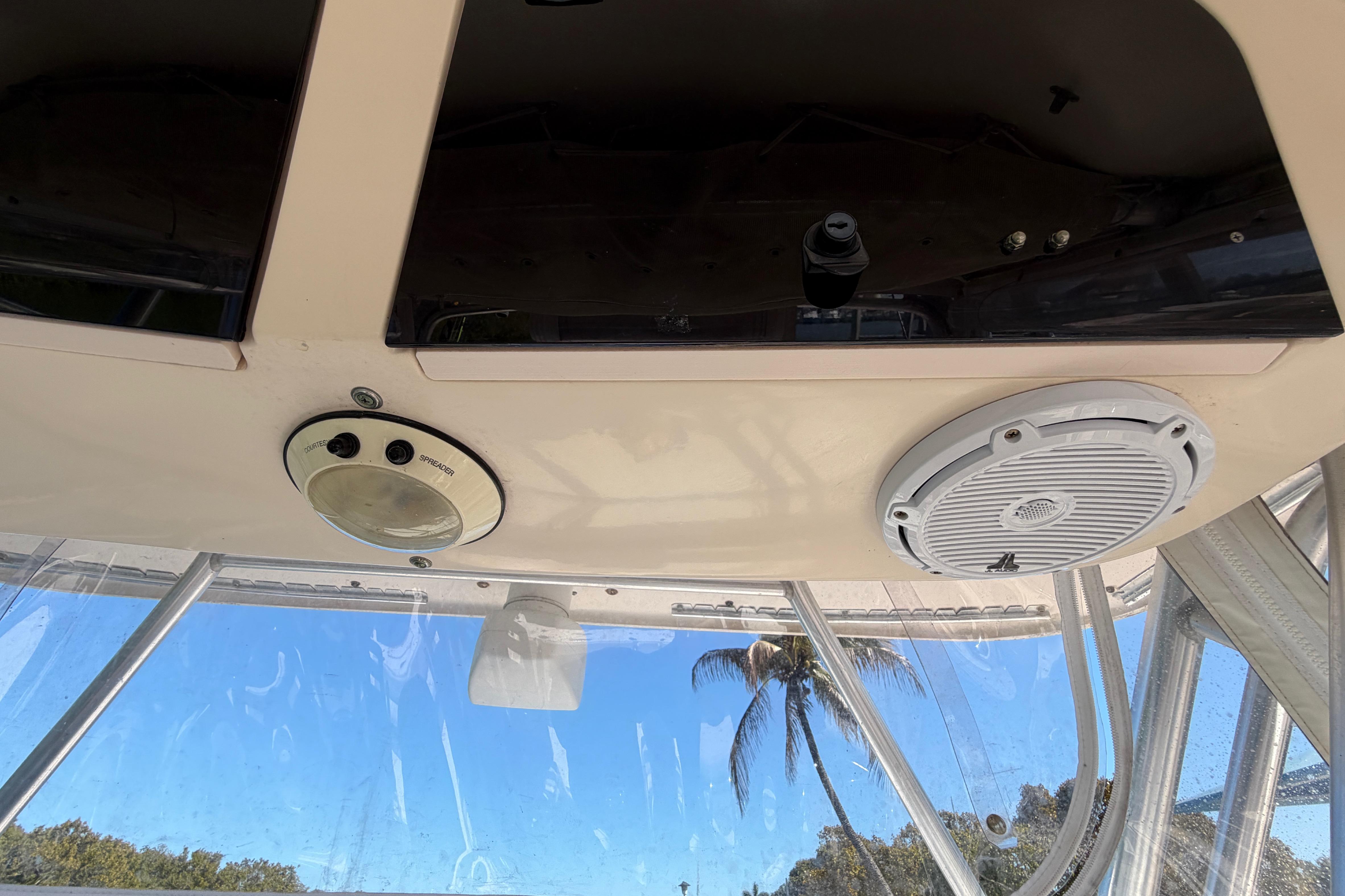 2006 Grady-White Sailfish 282 boat interior with speaker and control panel, clear sky view.