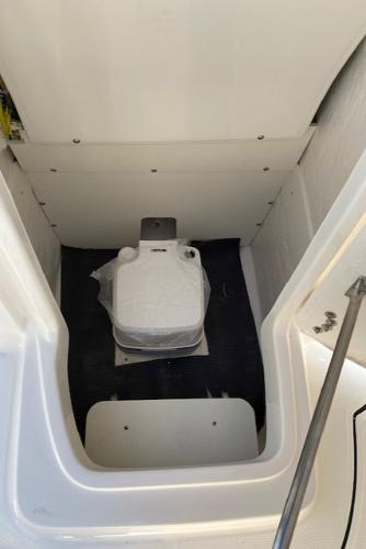 2024 Robalo R222 Center Console boat interior with marine toilet.
