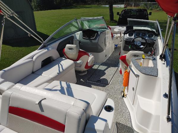 2014 Chaparral 224 Sunesta boat interior with white and red seating.
