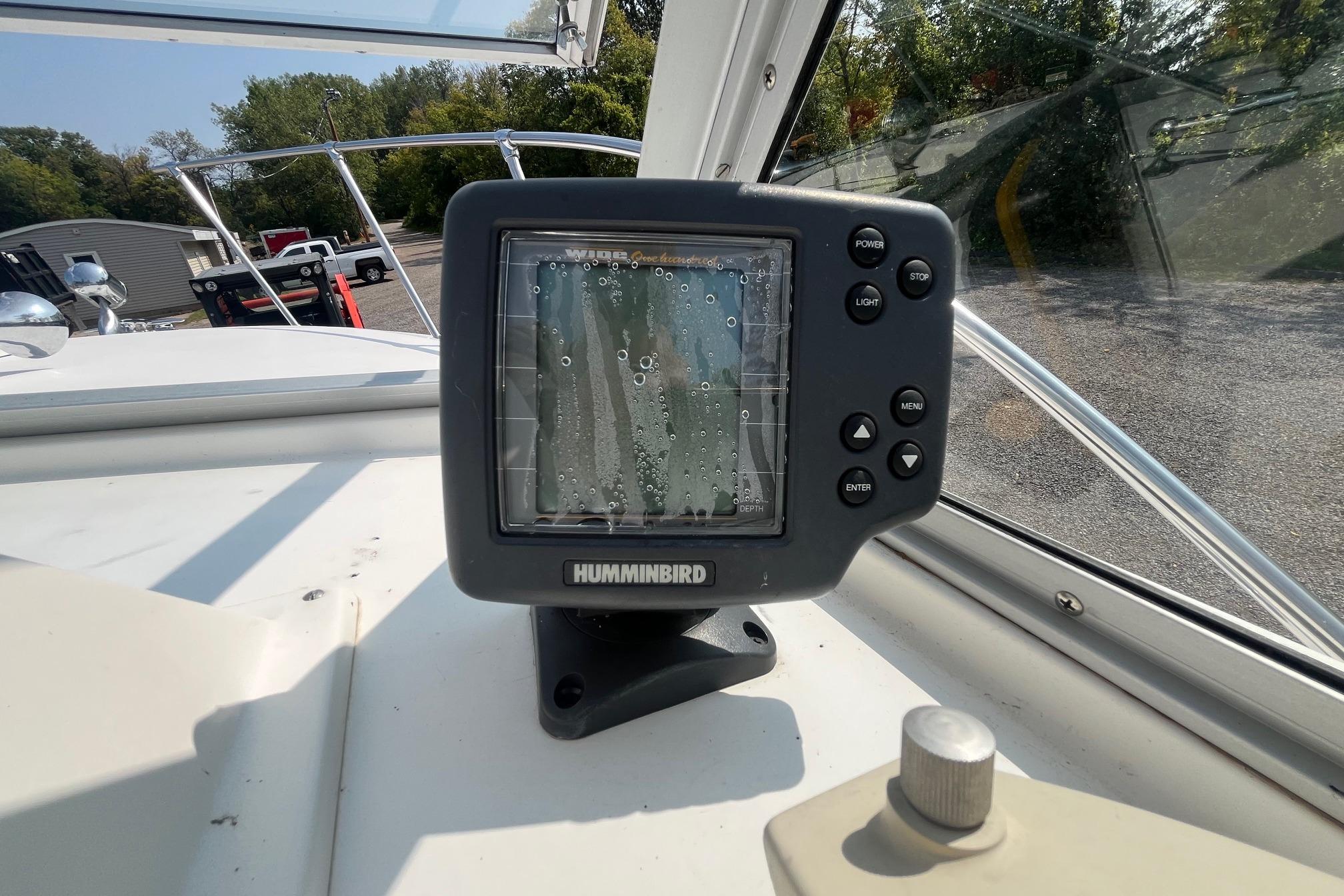 Humminbird fish finder on 1975 Bertram 26 Moppie boat dashboard.