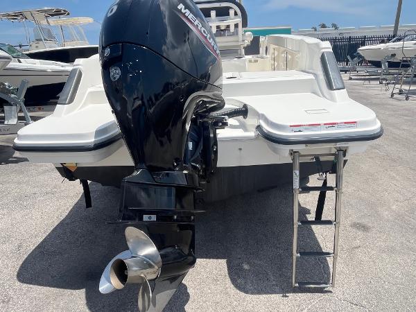 2022 Bayliner Trophy T22CC boat with Mercury outboard motor and swim ladder.