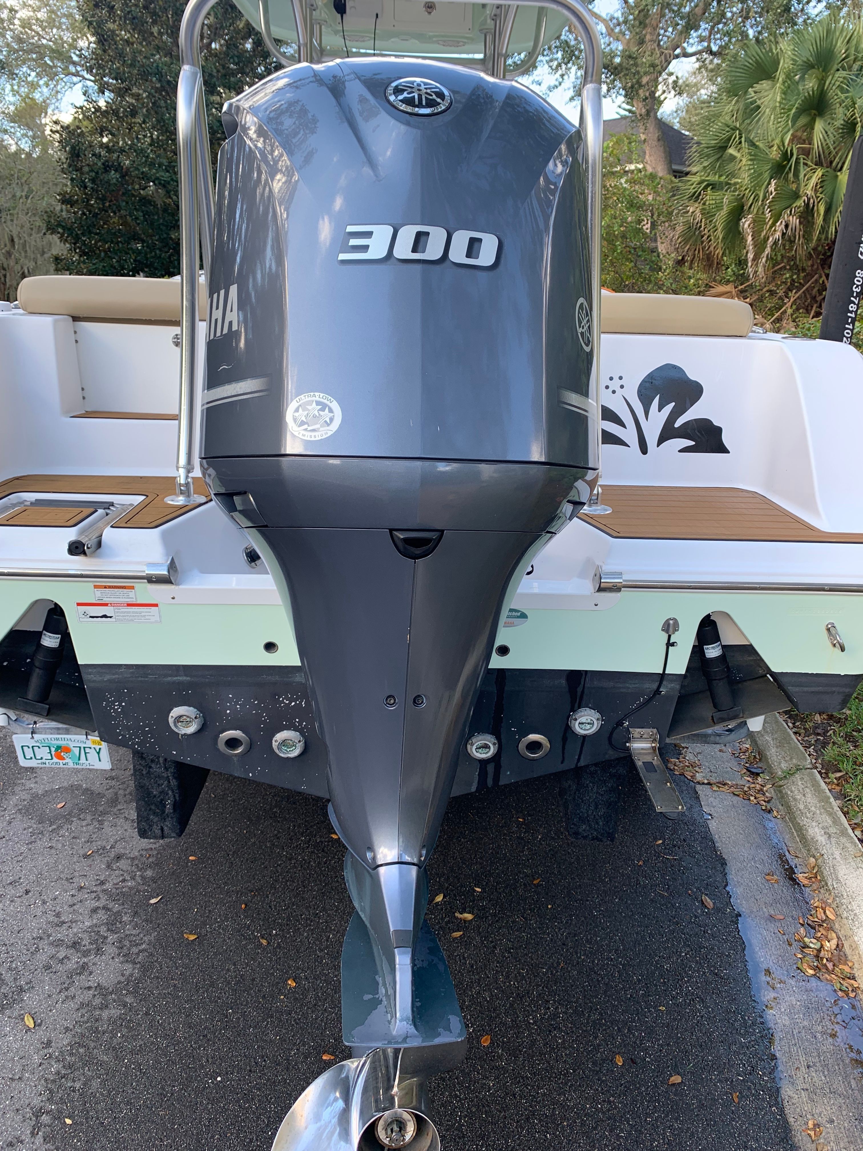 Rear view of a 2018 Sportsman Heritage 241 Center Console with a 300 HP outboard motor.