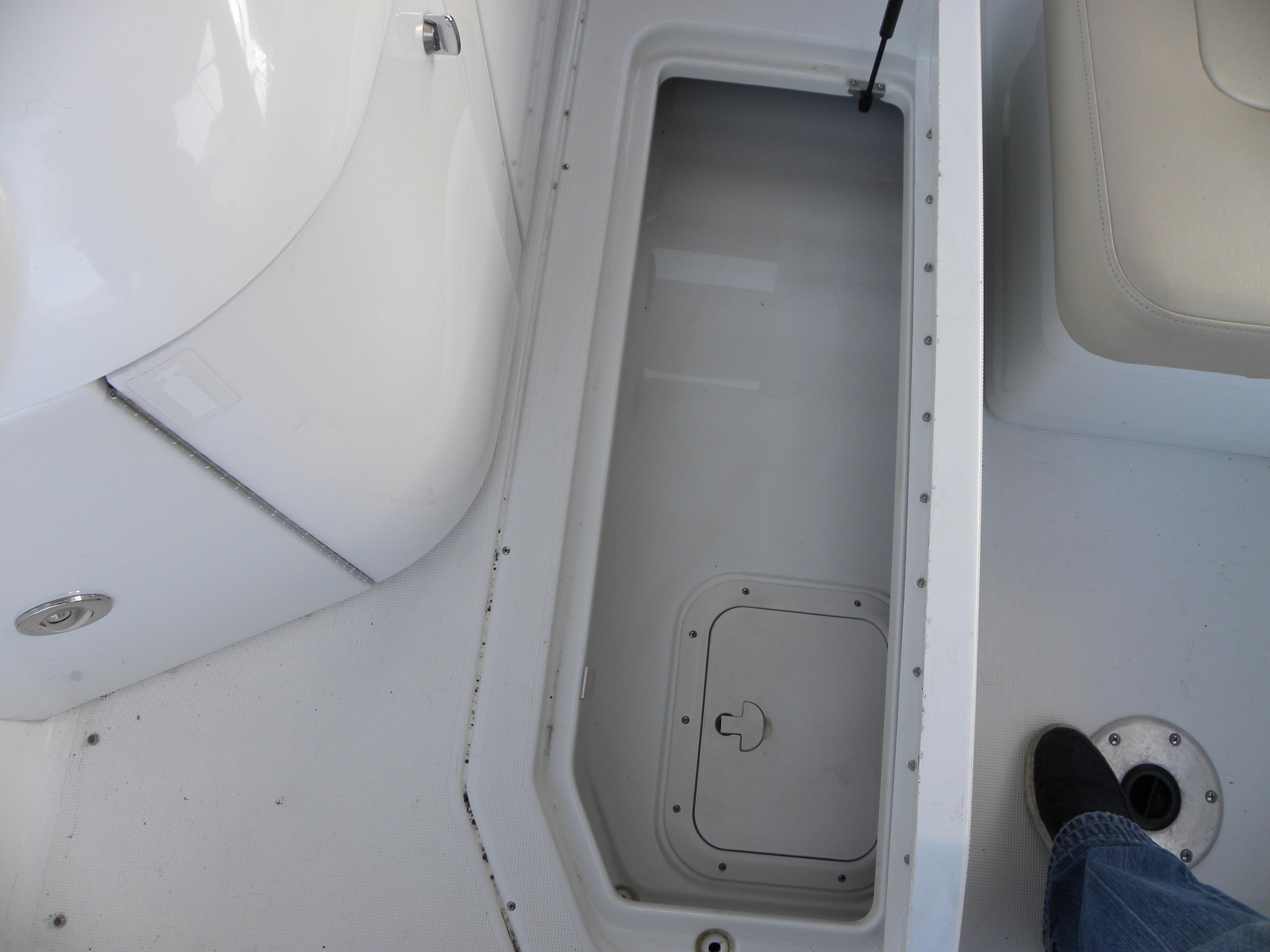 2011 Formula 290 Bowrider storage compartment with white interior.