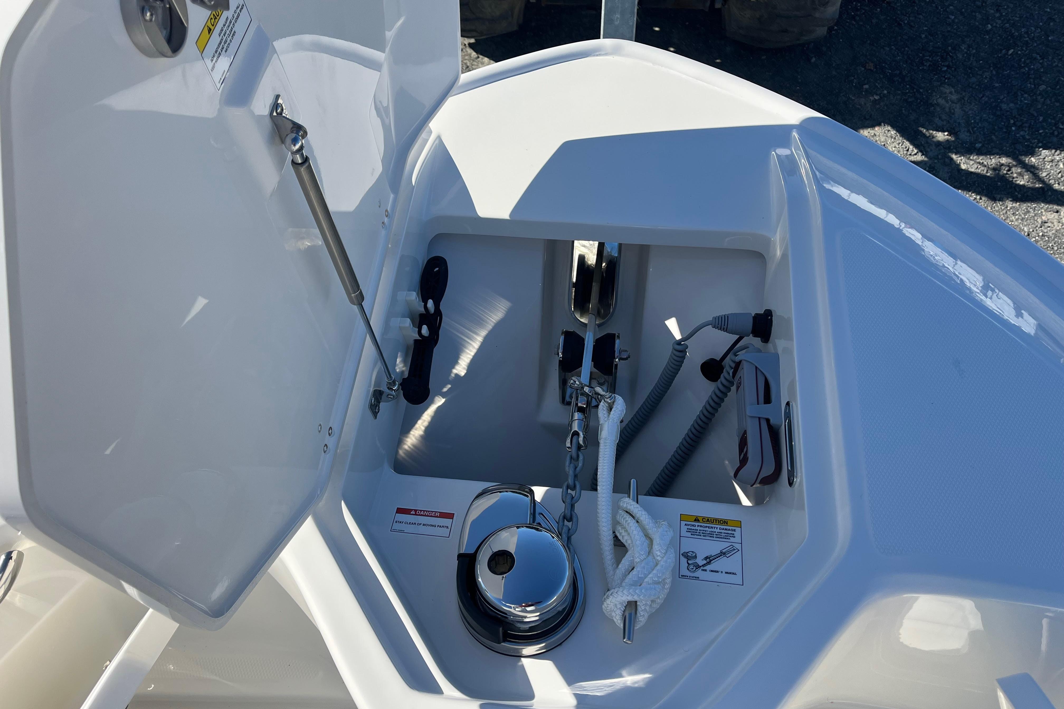 Anchor compartment of 2026 Boston Whaler 280 Dauntless, featuring storage and equipment.