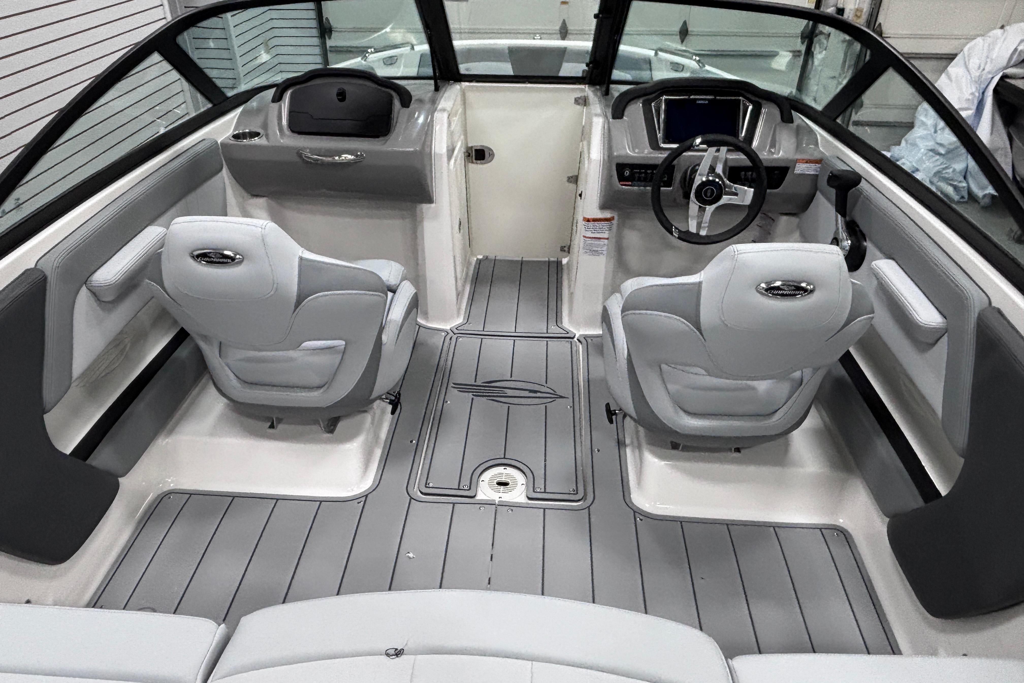 Interior of 2026 Chaparral 21 SSi boat with modern seating and steering console.