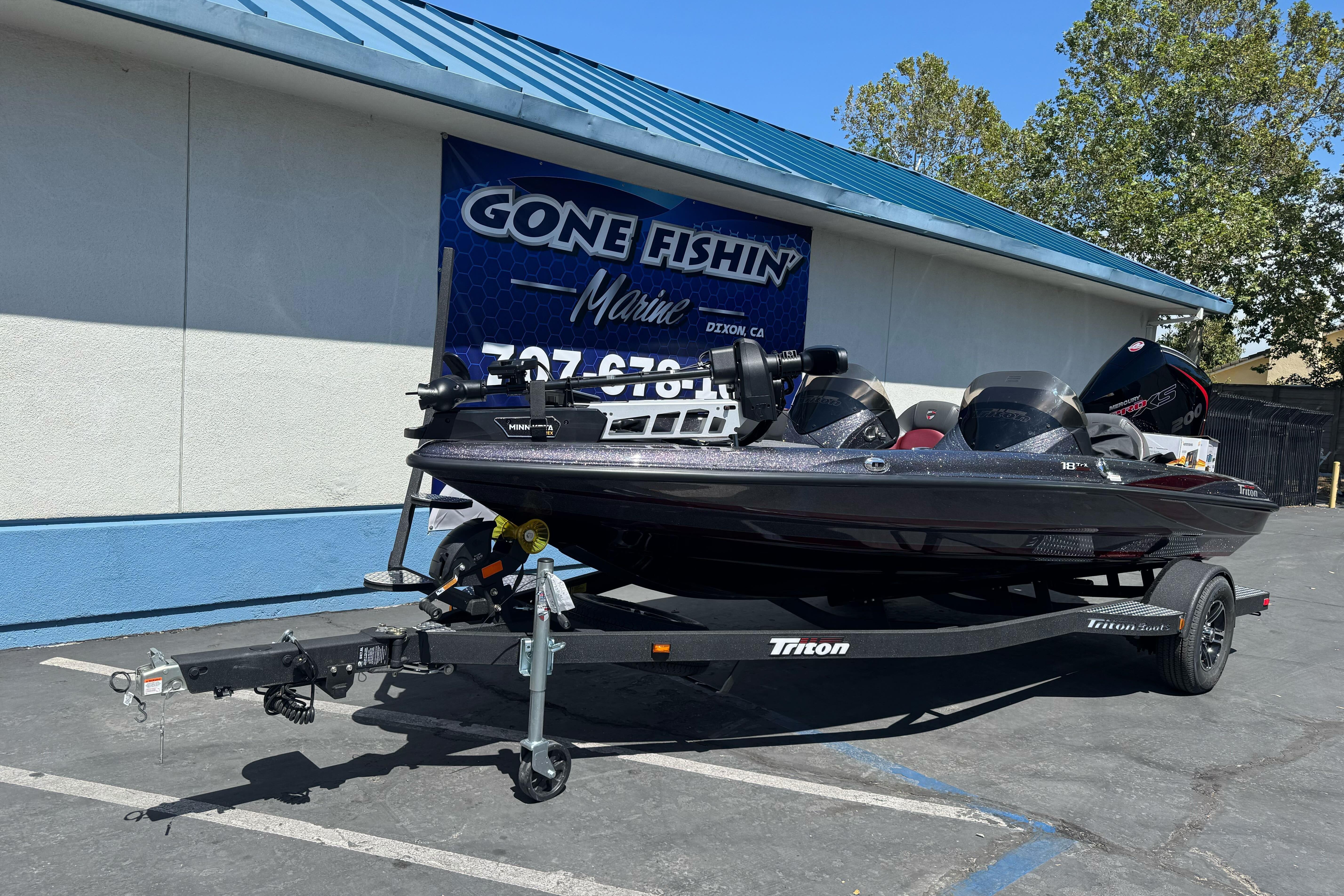 2026 Triton 18 TrX boat on trailer at Gone Fishin' Marine dealership.