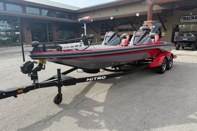 2026 Nitro Z21 XL boat on trailer, parked outside a building.