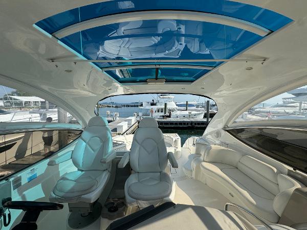 Luxurious 2003 Cruisers Yachts 540 Express interior with plush seating and panoramic views.
