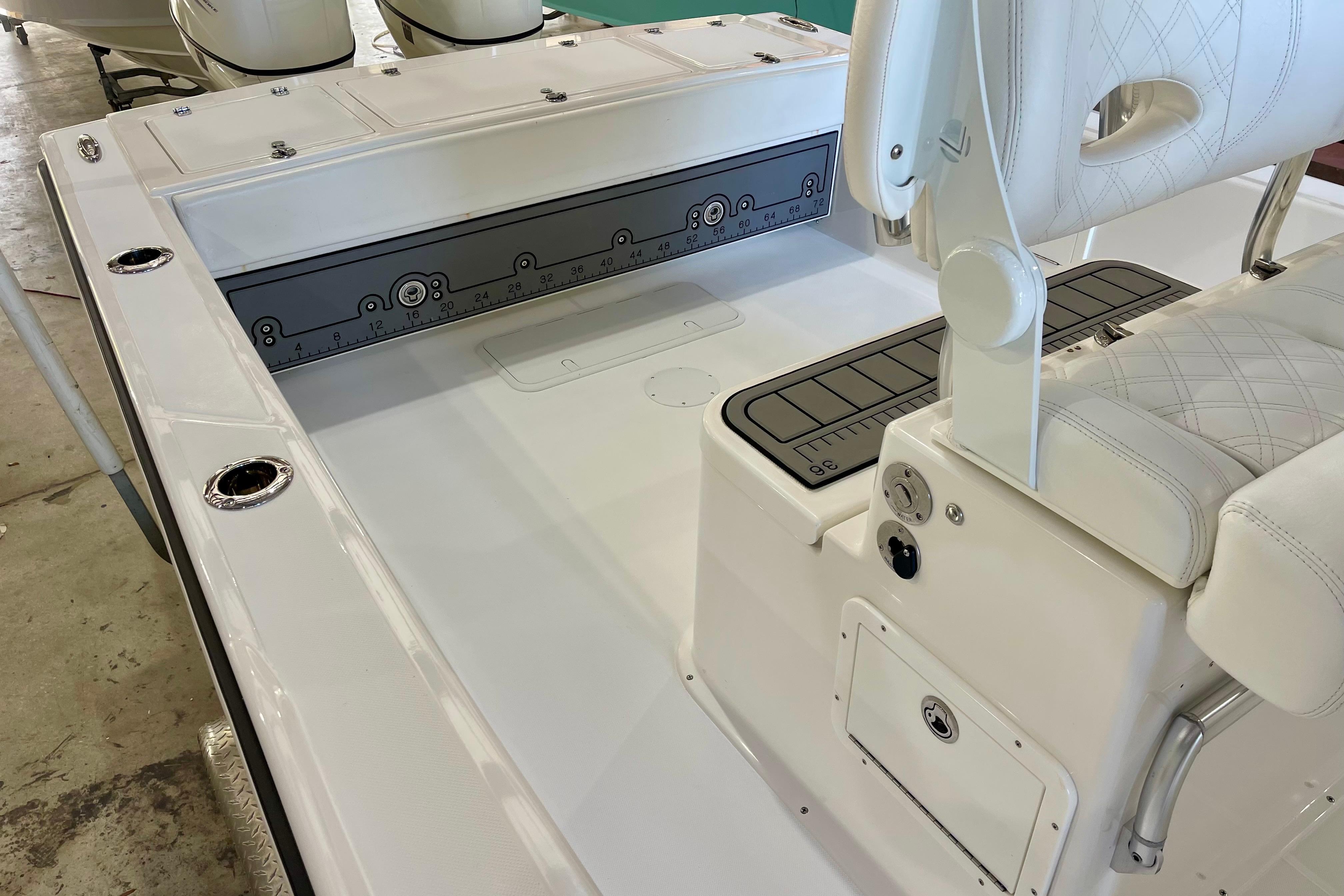 2025 Ocean Master 296 Center Console boat interior with seating and storage features.