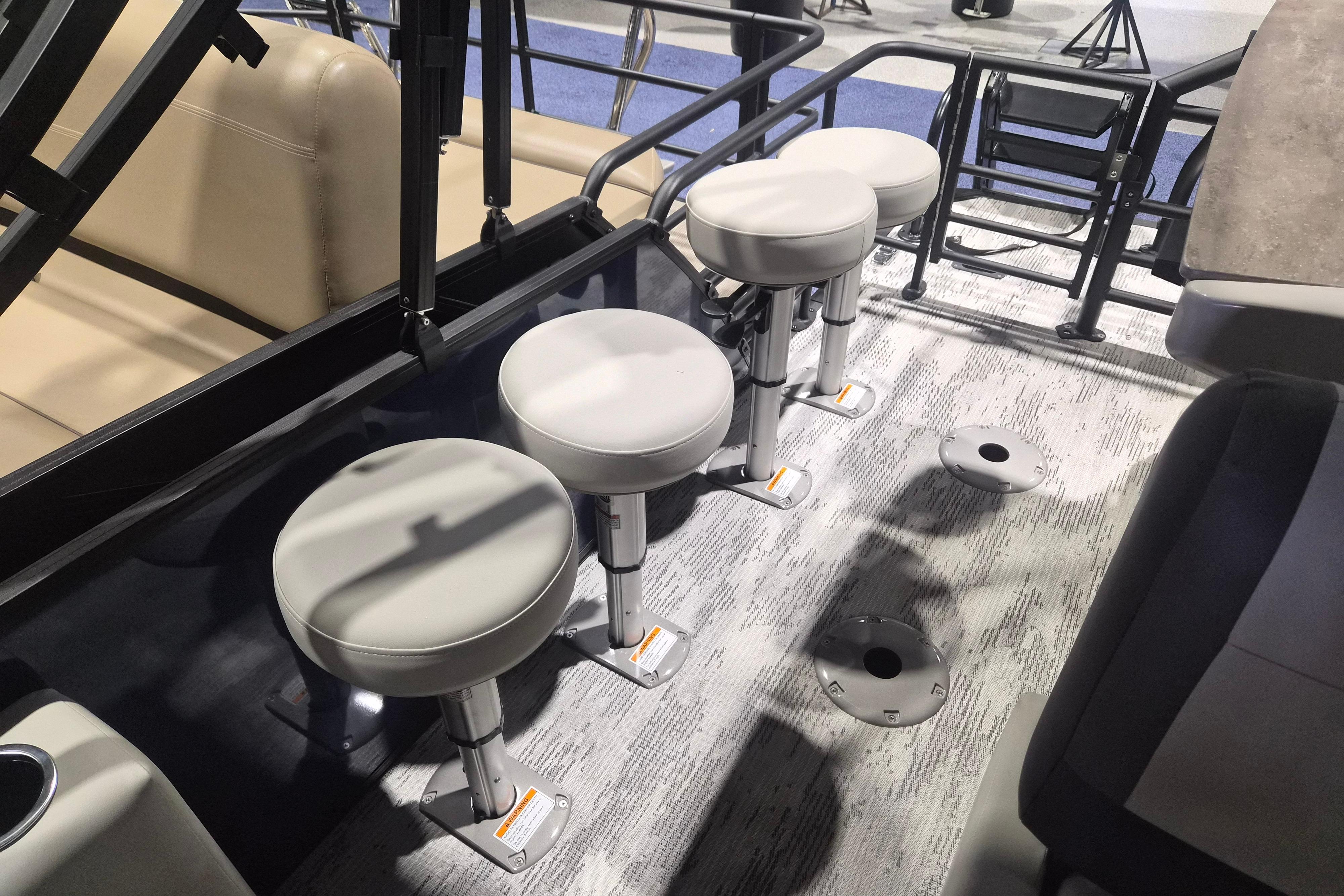 Four swivel seats on a 2026 Sylvan R-22 LZ DH boat deck.