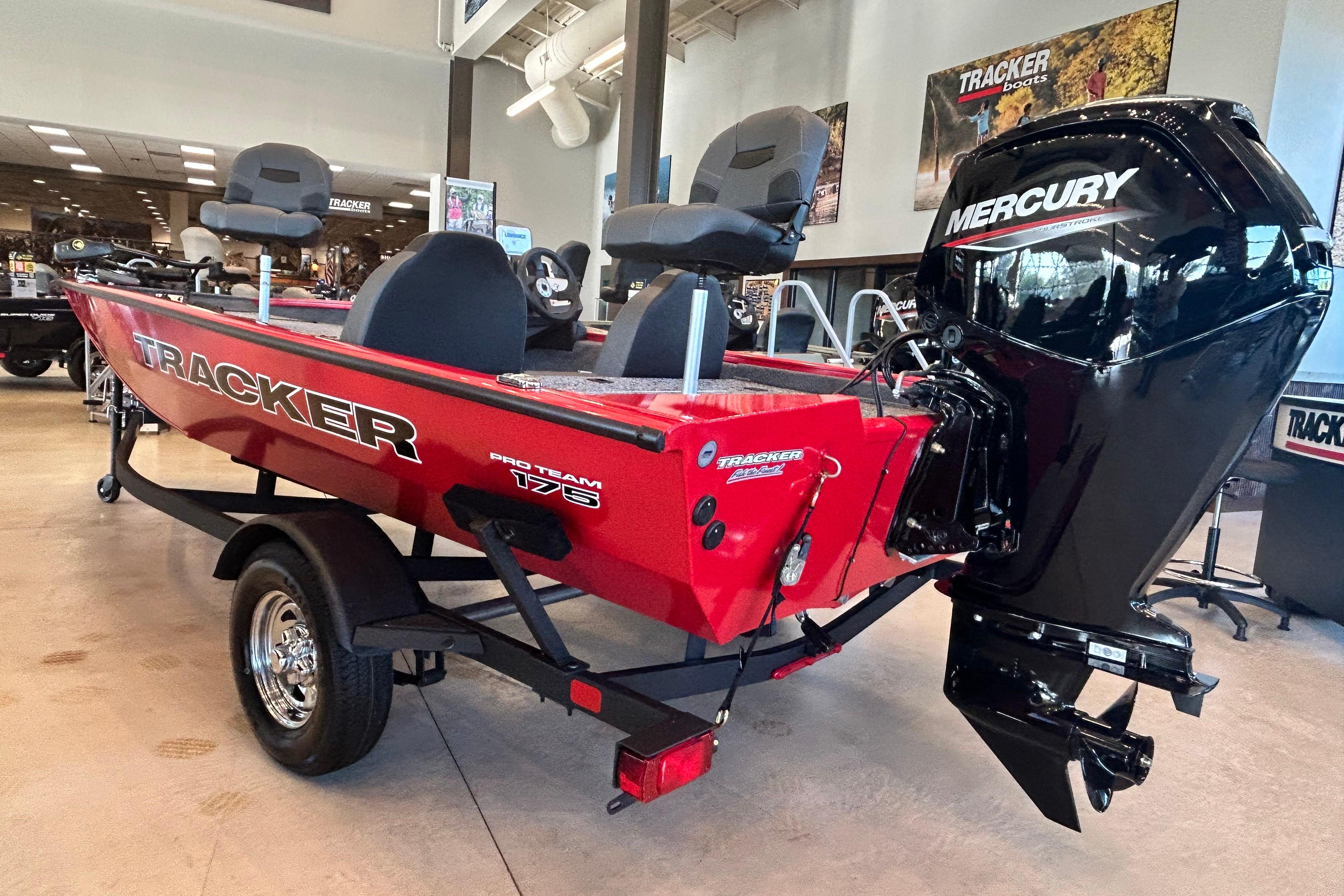 2026 Tracker Pro Team 175 boat with Mercury engine in showroom.