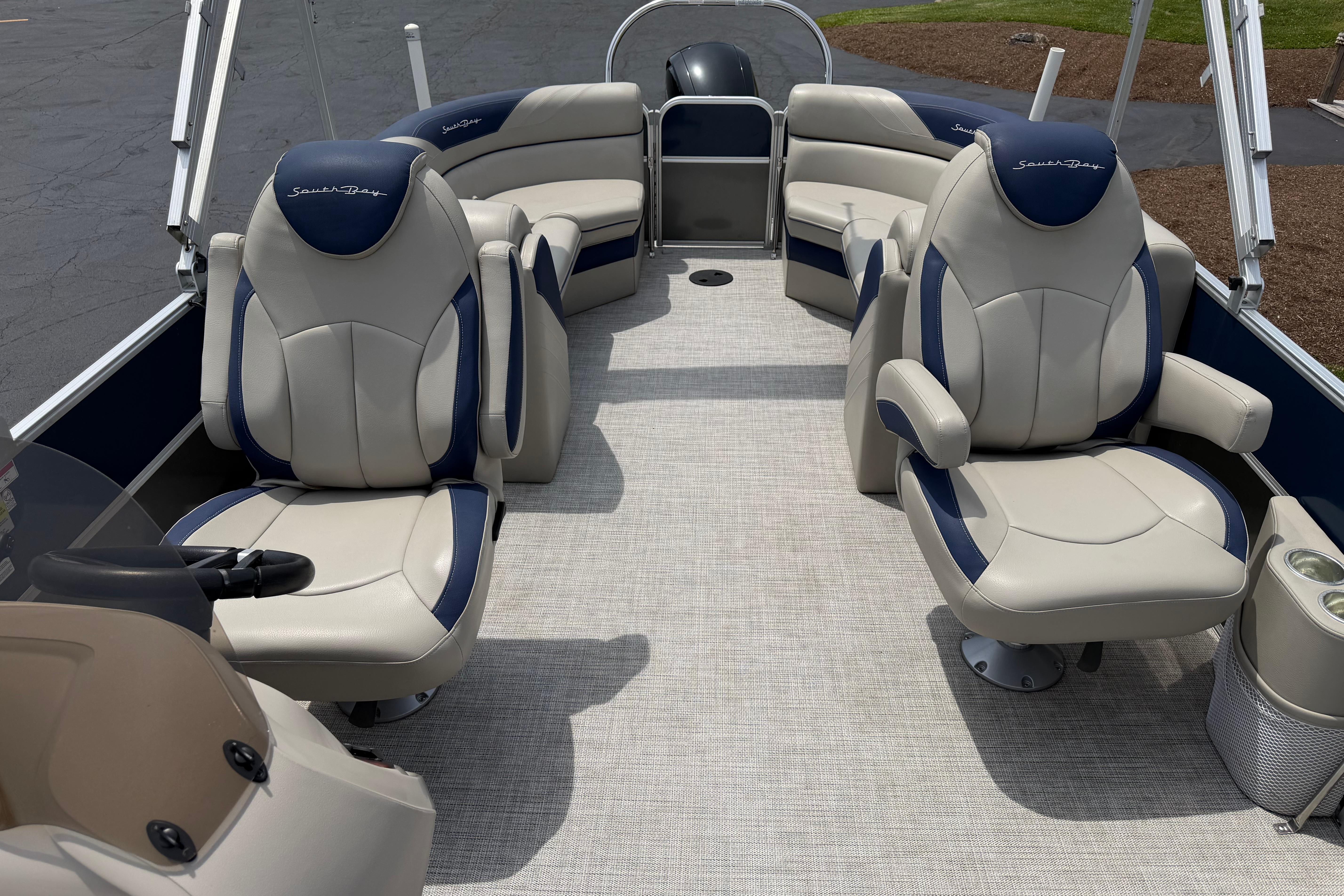 Luxurious interior of 2021 South Bay 224RS LE pontoon boat with plush seating.
