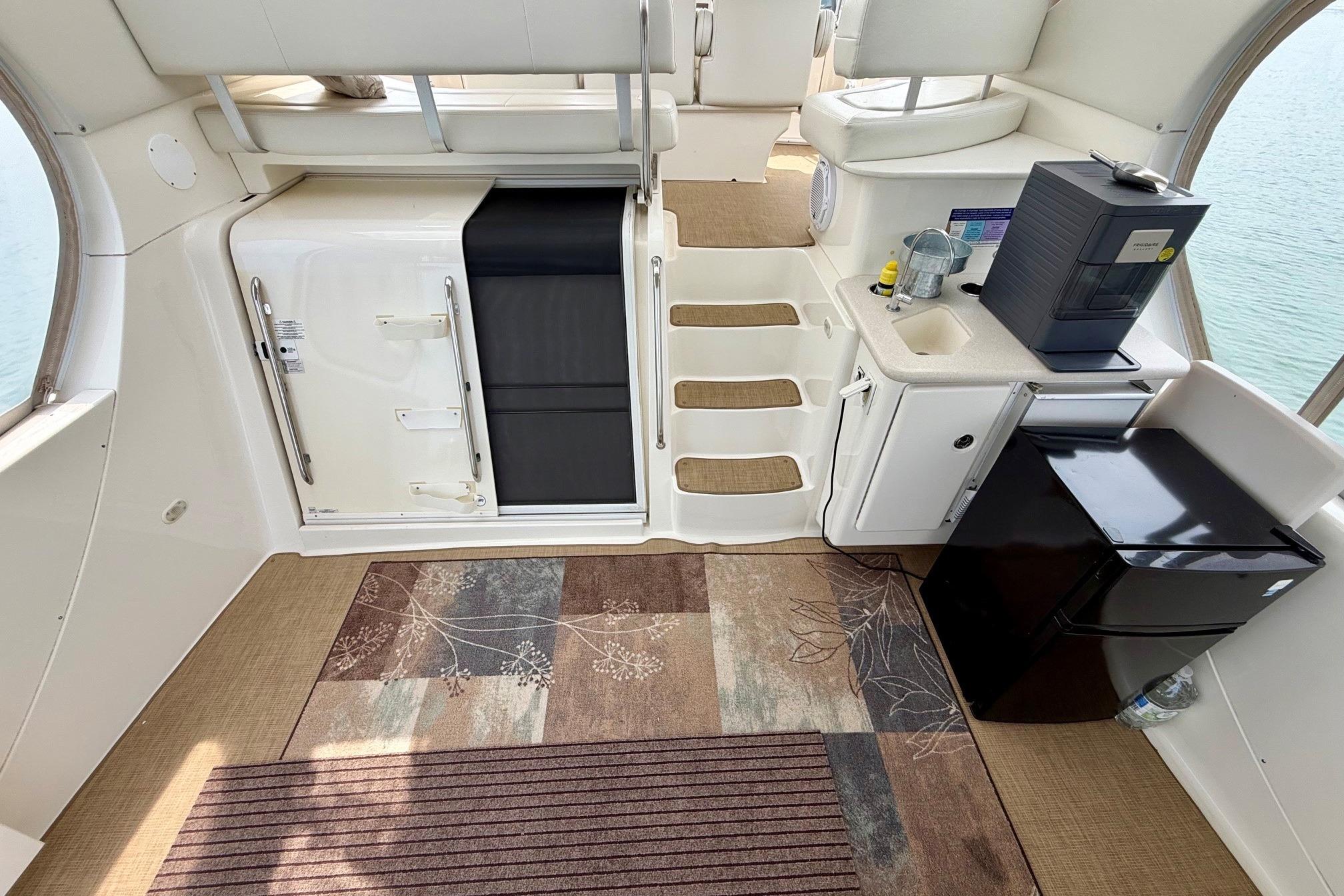 Interior of 2004 Silverton 39 Motor Yacht with kitchenette and seating area.