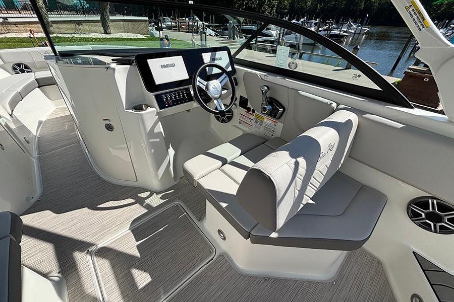 2027 Sea Ray SDX 230 Outboard boat interior with modern helm and seating.
