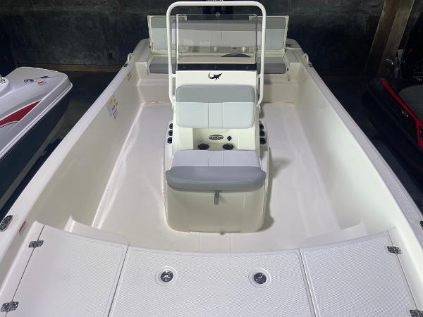 2024 Mako Pro Skiff 19 CC center console boat interior, white with seating and storage.