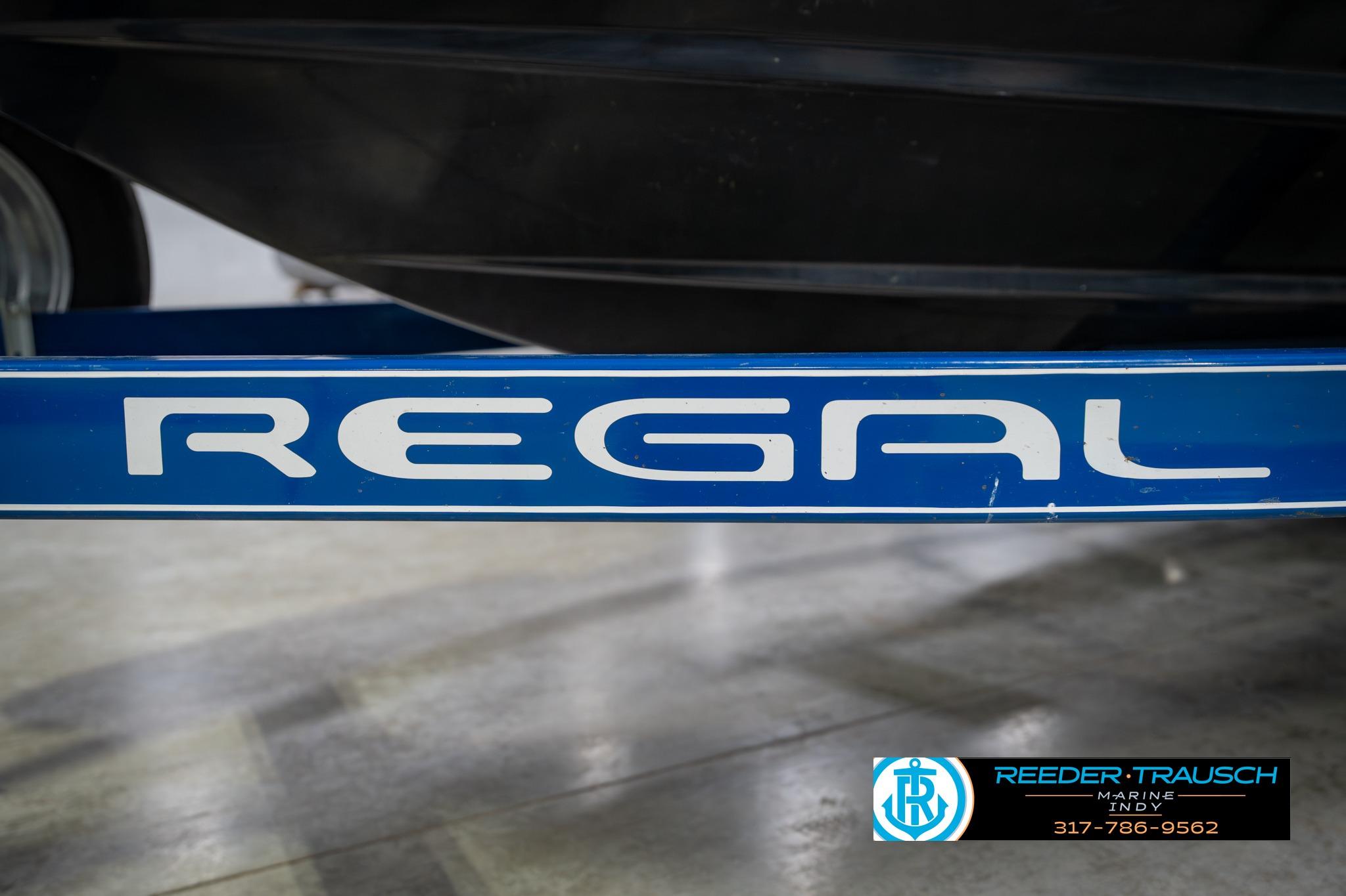 2015 Regal 2000 ESX Bowrider boat trailer with logo, displayed indoors.