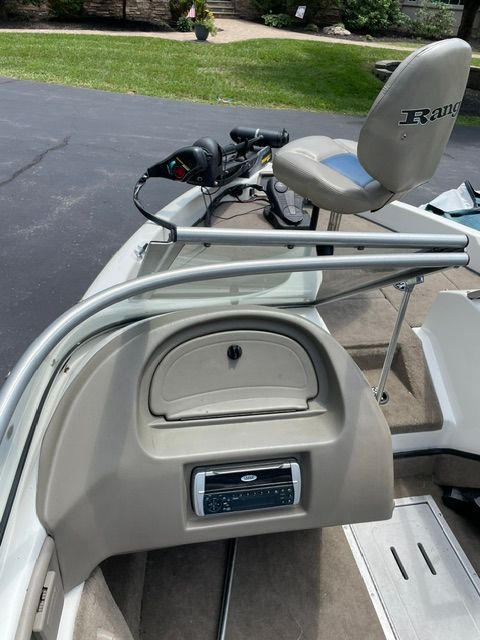 The image shows the cockpit of a 2004 Ranger 190 Reata boat with a helm and seat.