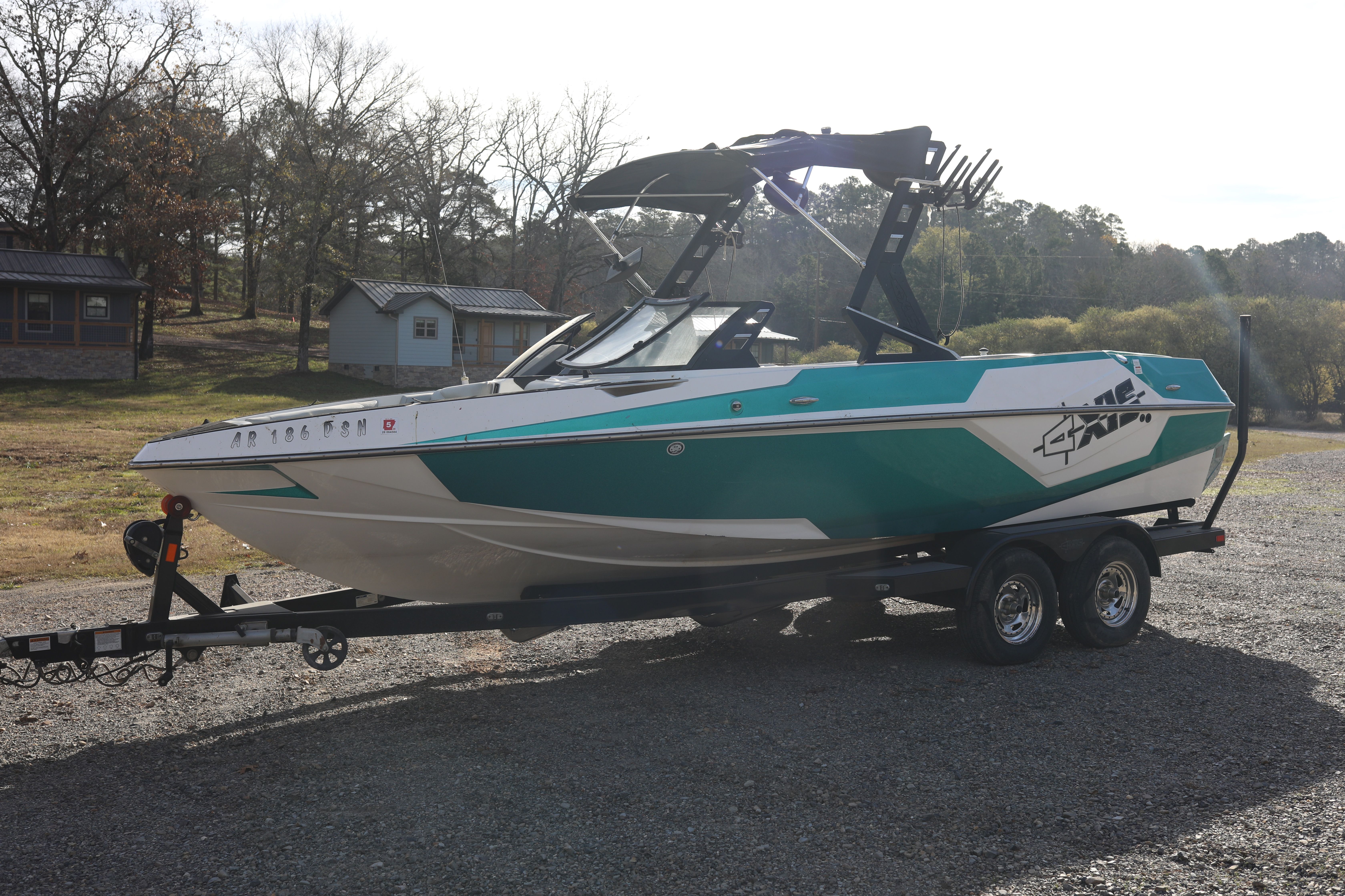 2019 Axis T22 boat on trailer parked outdoors.